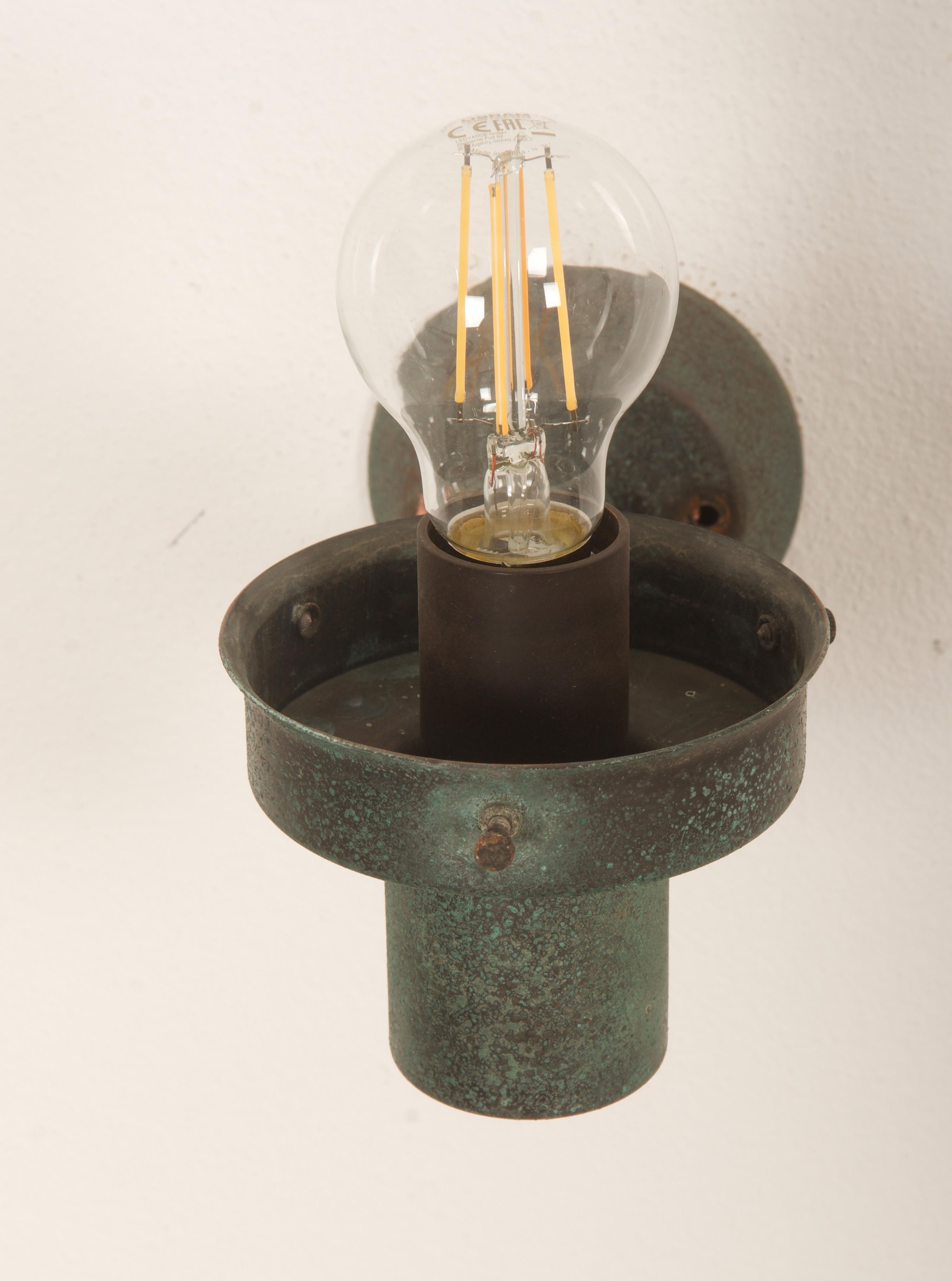 A Pair Of Outdoor Metal Wall Lamps With Glass Shades 9
