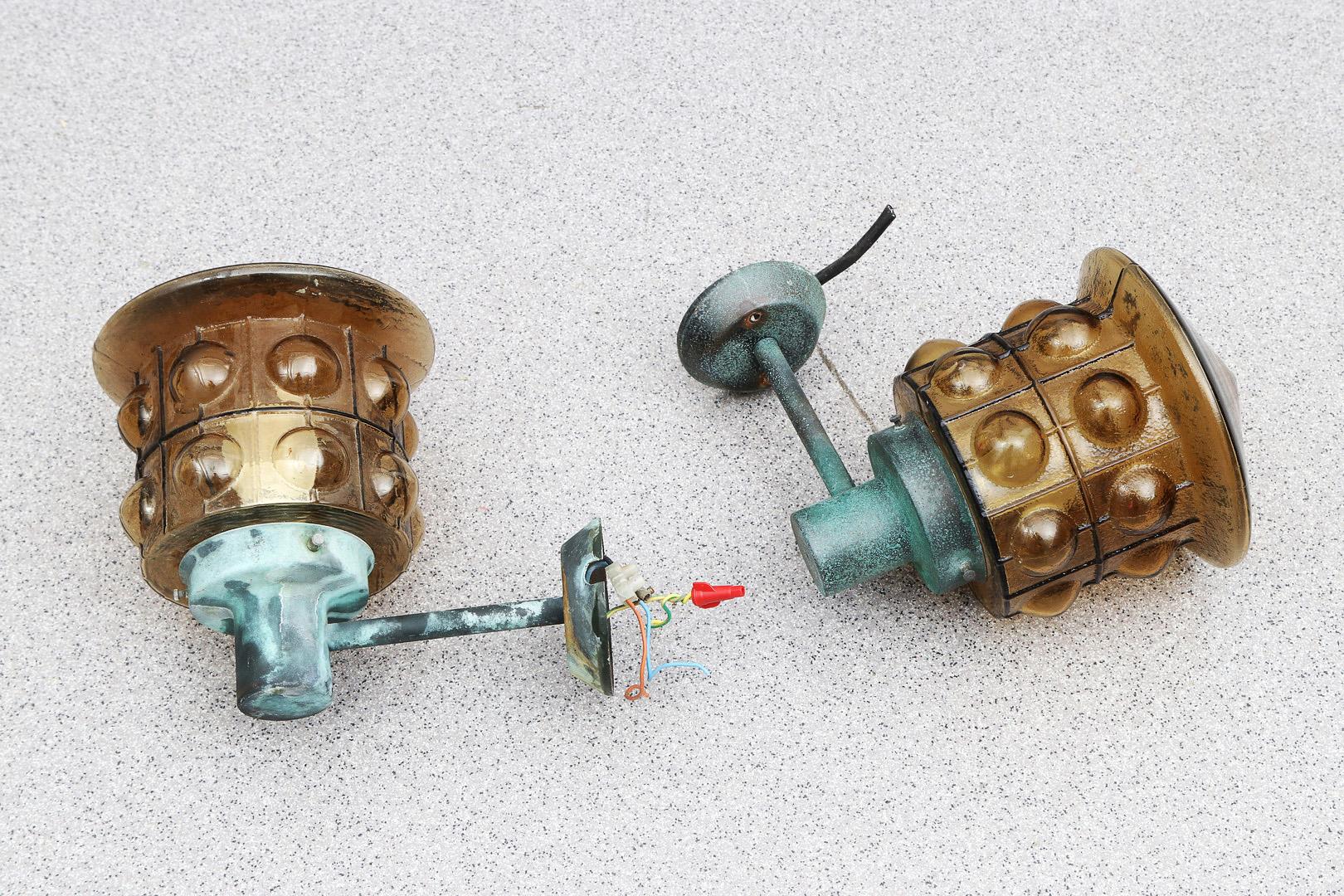 A Pair Of Outdoor Metal Wall Lamps With Glass Shades 10