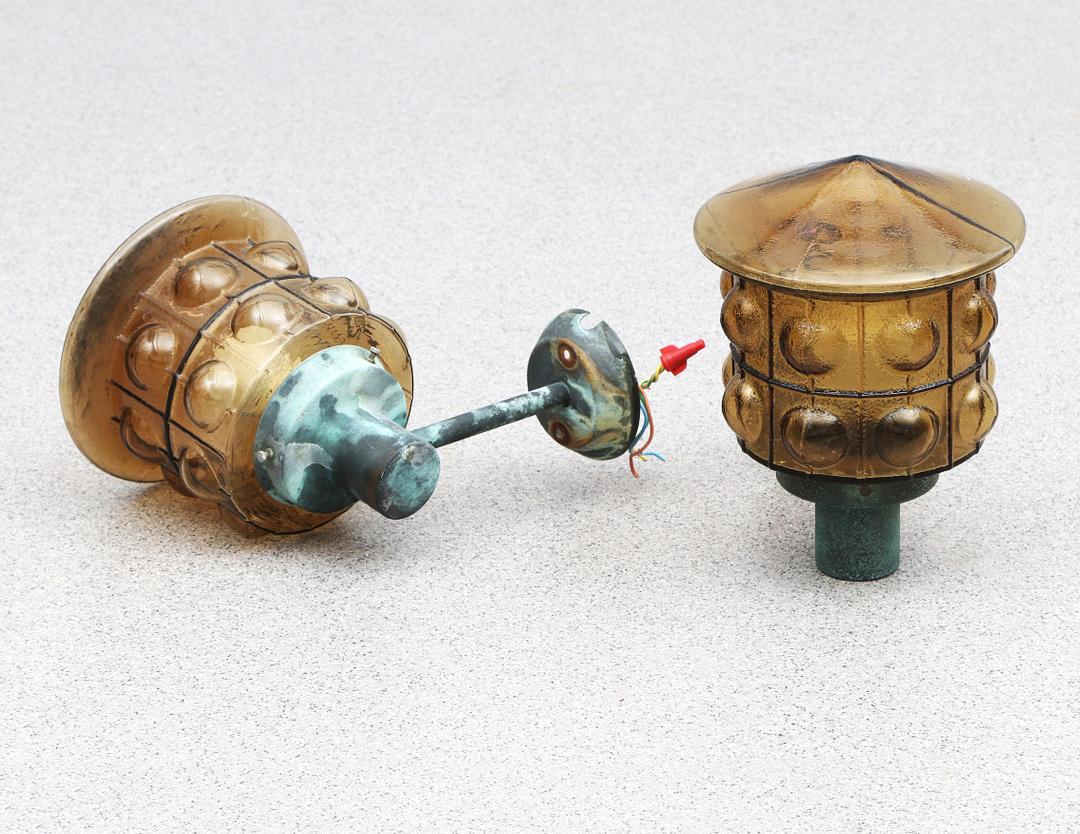 A Pair Of Outdoor Metal Wall Lamps With Glass Shades 11