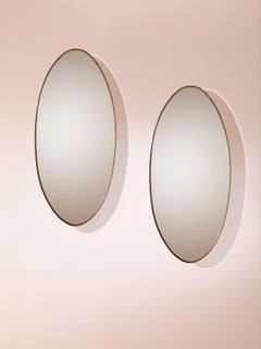 A pair of oval brass mirrors, Italy, 1960s