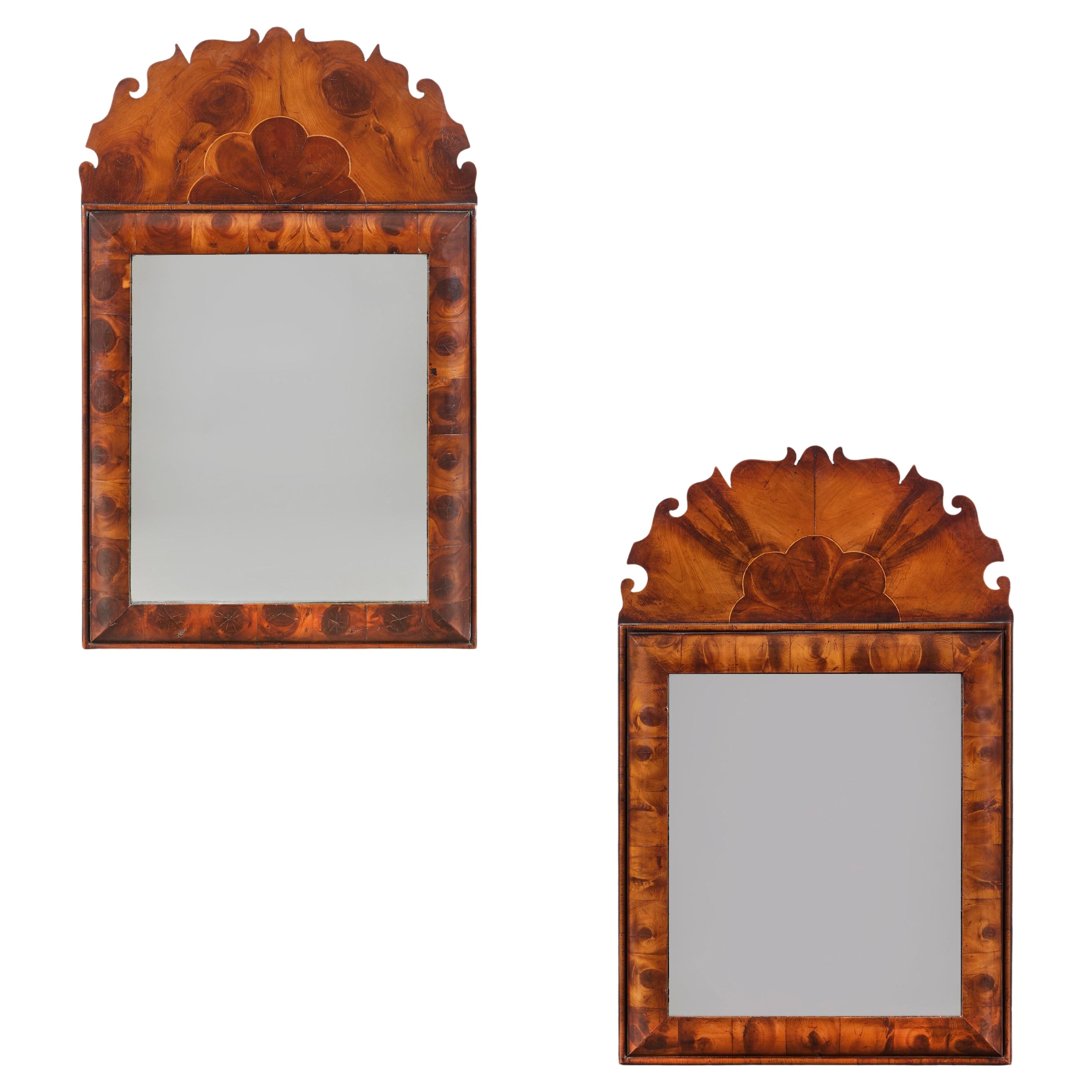 A Pair of Oyster Veneered Cushion Frame Pier Mirrors