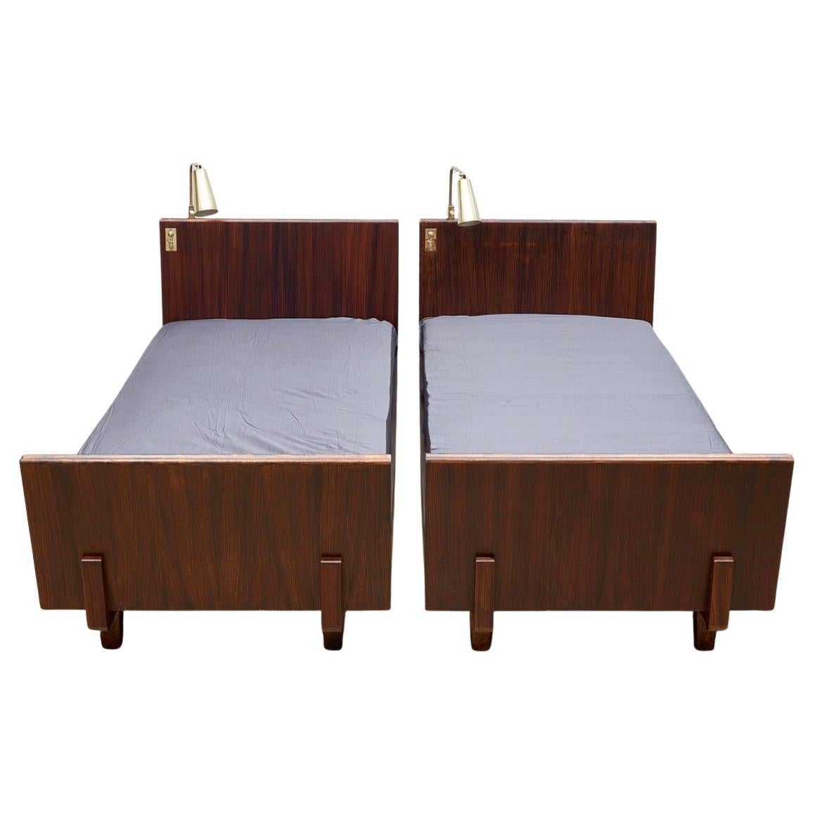 a pair of Paavo Tynell lamps and Erkki Huttunen beds, hotel Vaakuna. For Sale