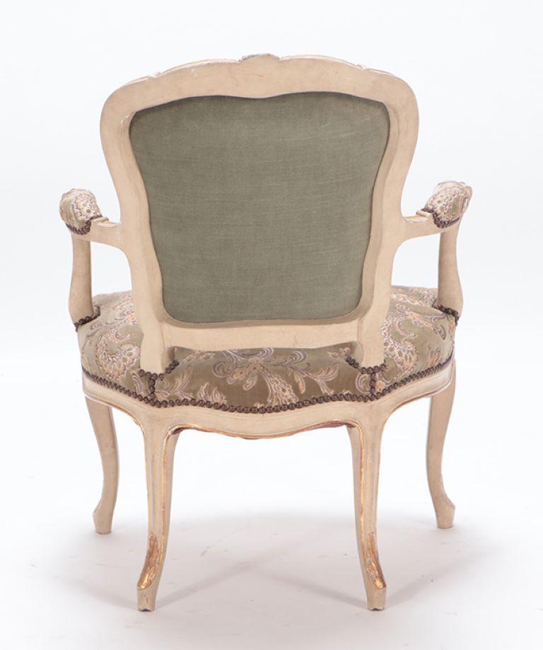 Upholstery A pair of painted and giltwood French upholstered open armchairs Louis XV style For Sale