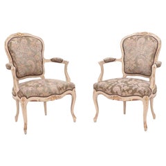 A pair of painted and giltwood French upholstered open armchairs Louis XV style