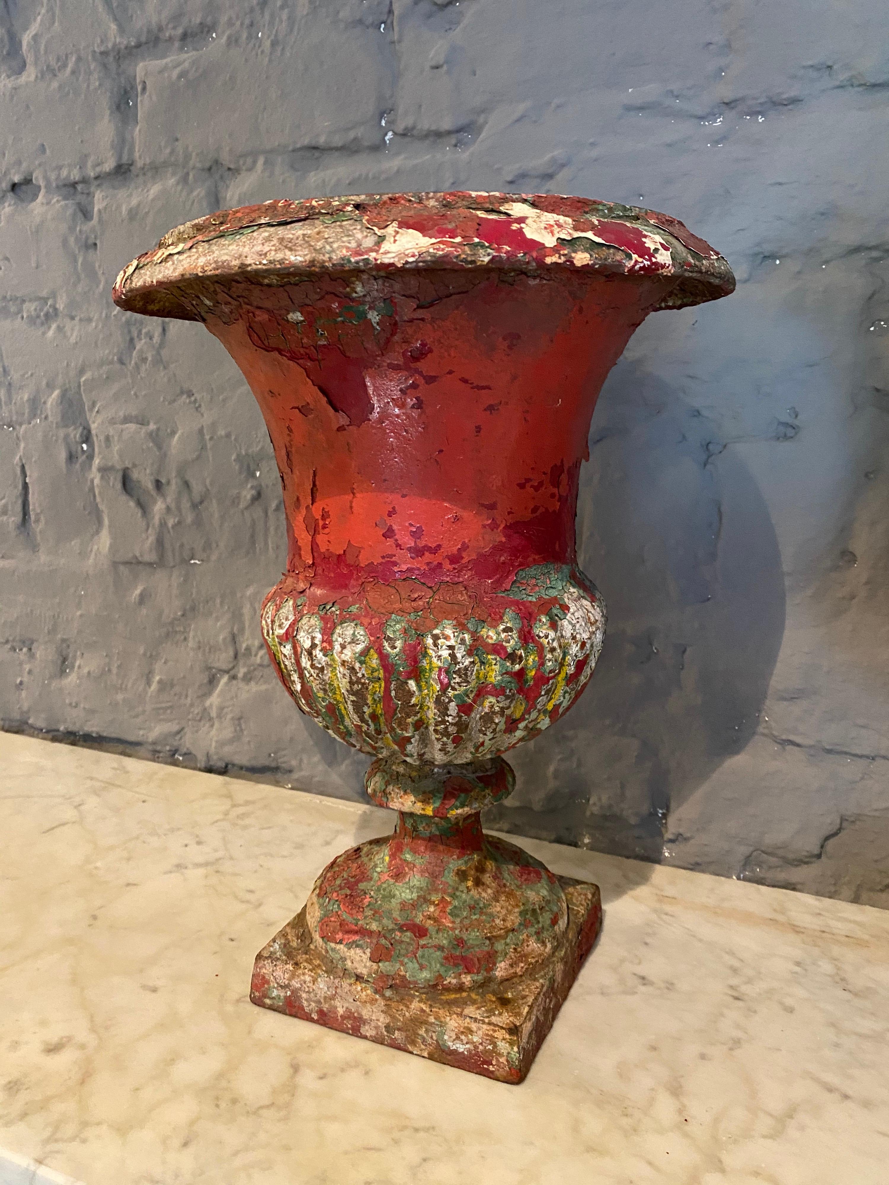 A charming pair of Campagna cast iron urns retaining old painted patina. 

French, late 19th century.