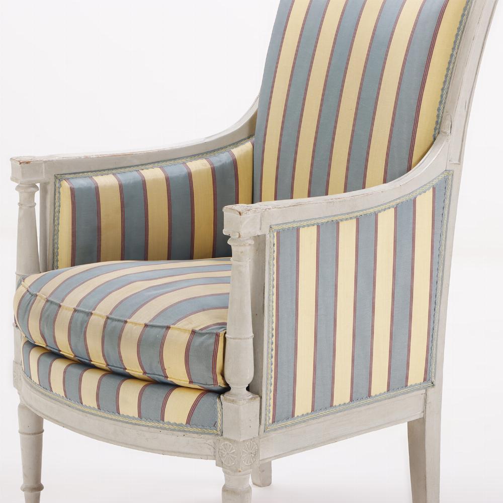 Early 20th Century A pair of painted French Directoire style bergere chairs C 1900. For Sale