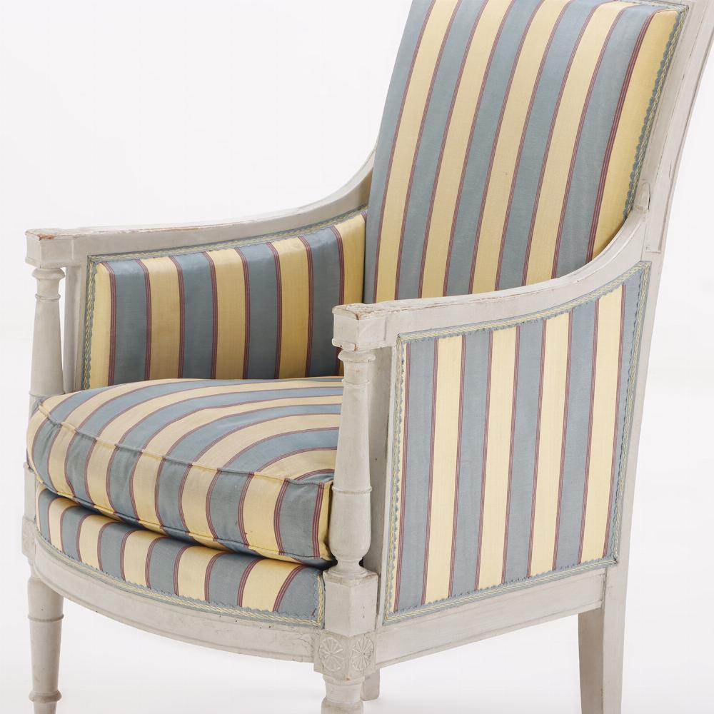 Upholstery A pair of painted French Directoire style bergere chairs C 1900. For Sale