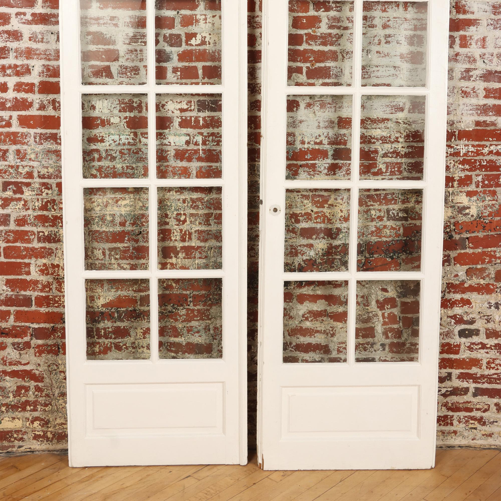A pair of painted French doors. C 1900.Each door with 12 panes of glass.
Each door: 28.75