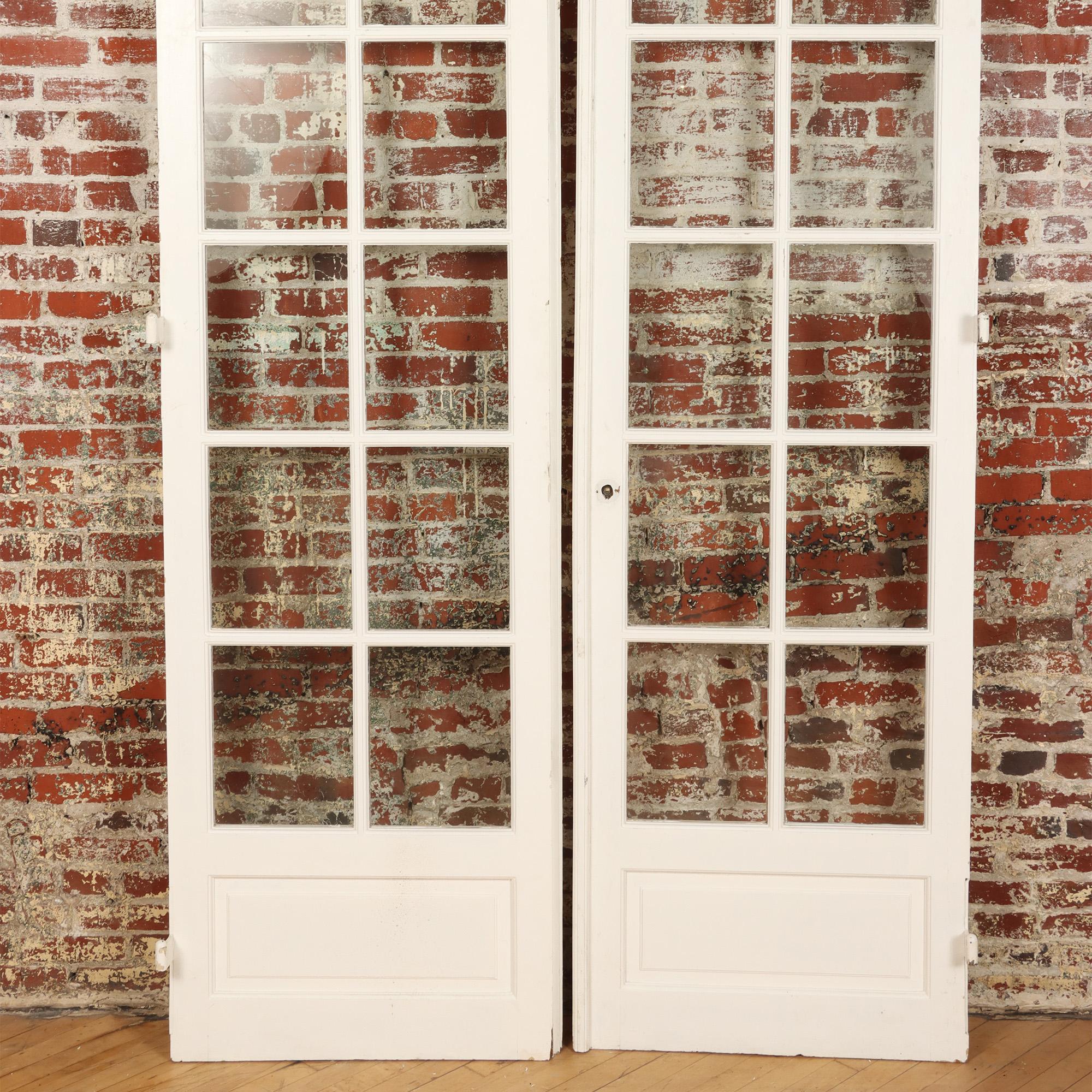 A pair of painted French doors C 1900. There are 12 panes of glass on each door.
Each door W: 28.75