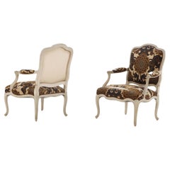 A pair of painted French Louis XV style open armchairs circa 1920.