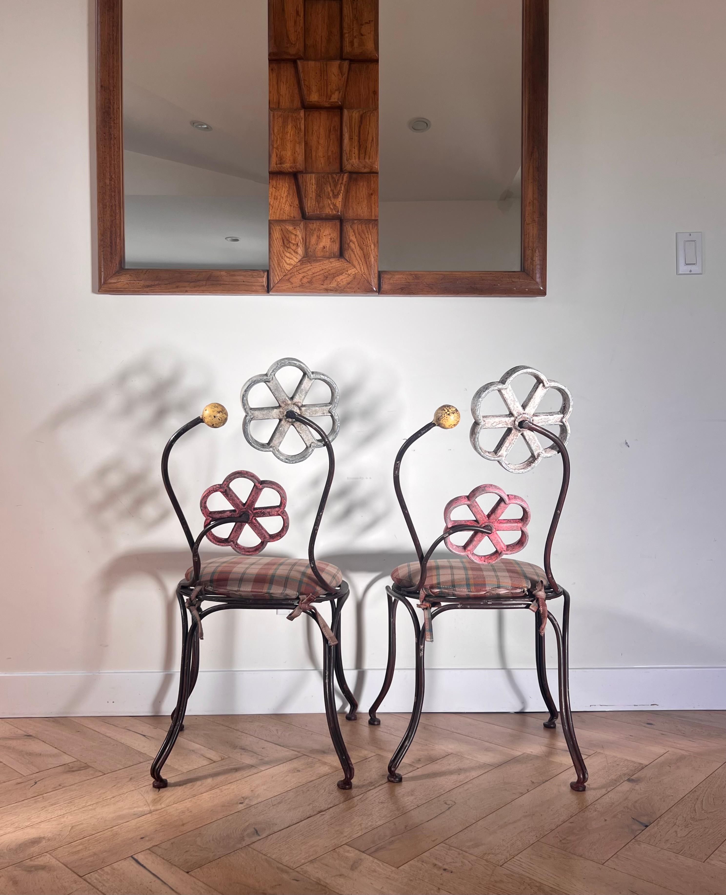 A pair of painted iron chairs by Joe Brown for Anthropologie, early aughts 1