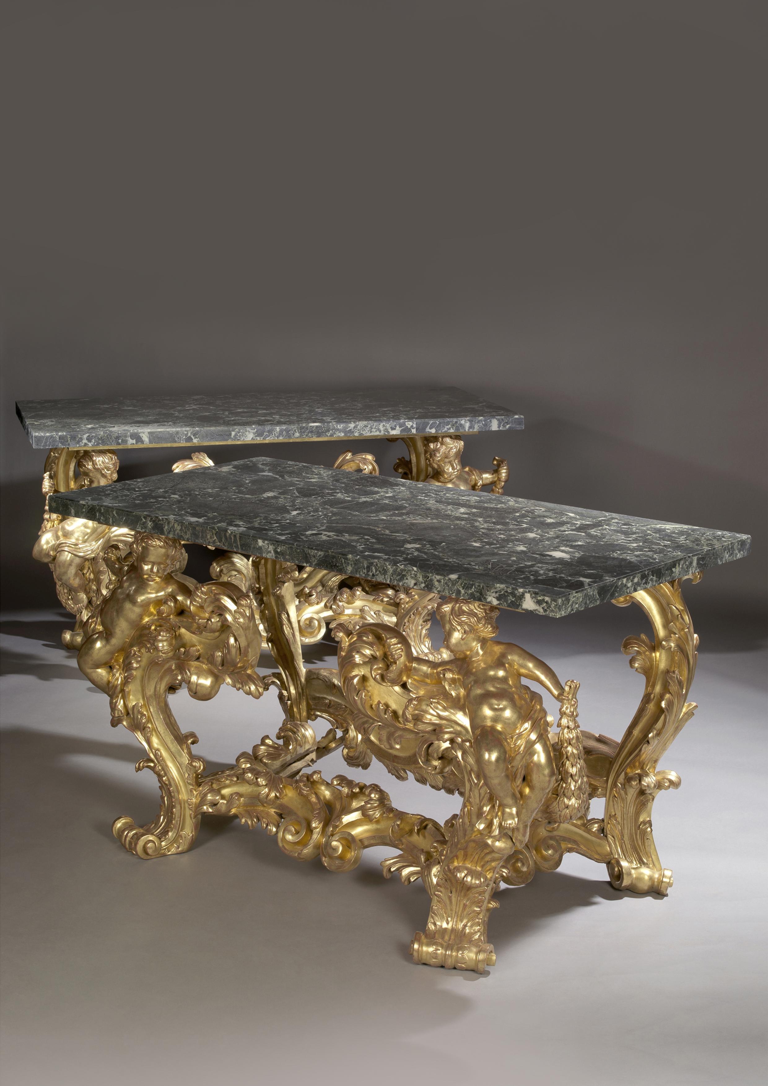 A magnificent and important pair of Palatial giltwood console tables with Verde Antico marble tops.

Italian or French, circa 1870. 

This exceptional pair of giltwood console tables each have rectangular verde antico marble tops supported by
