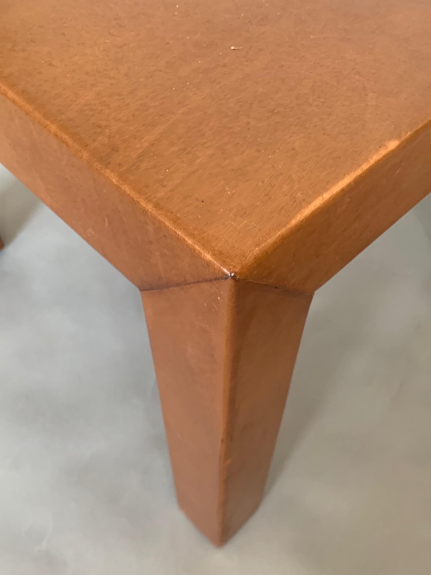A pair of custom occasional tables done in cognac leather by MHG Studio.
