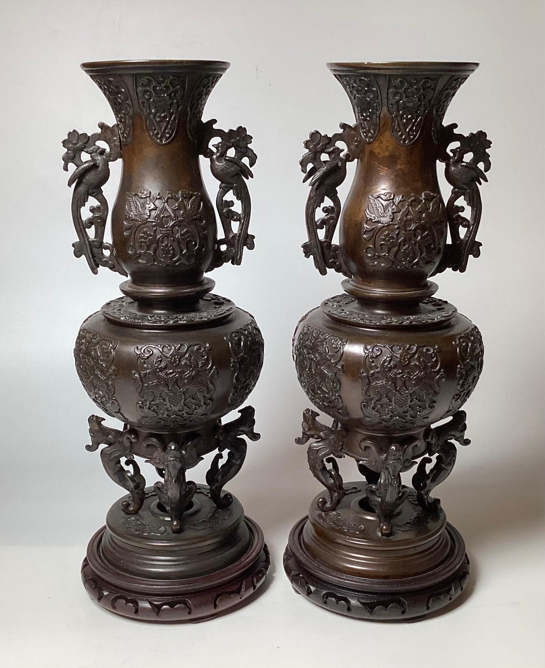 A Pair of Patinated Bronze Meiji Period Figural Tall Vases  In Excellent Condition For Sale In Lambertville, NJ