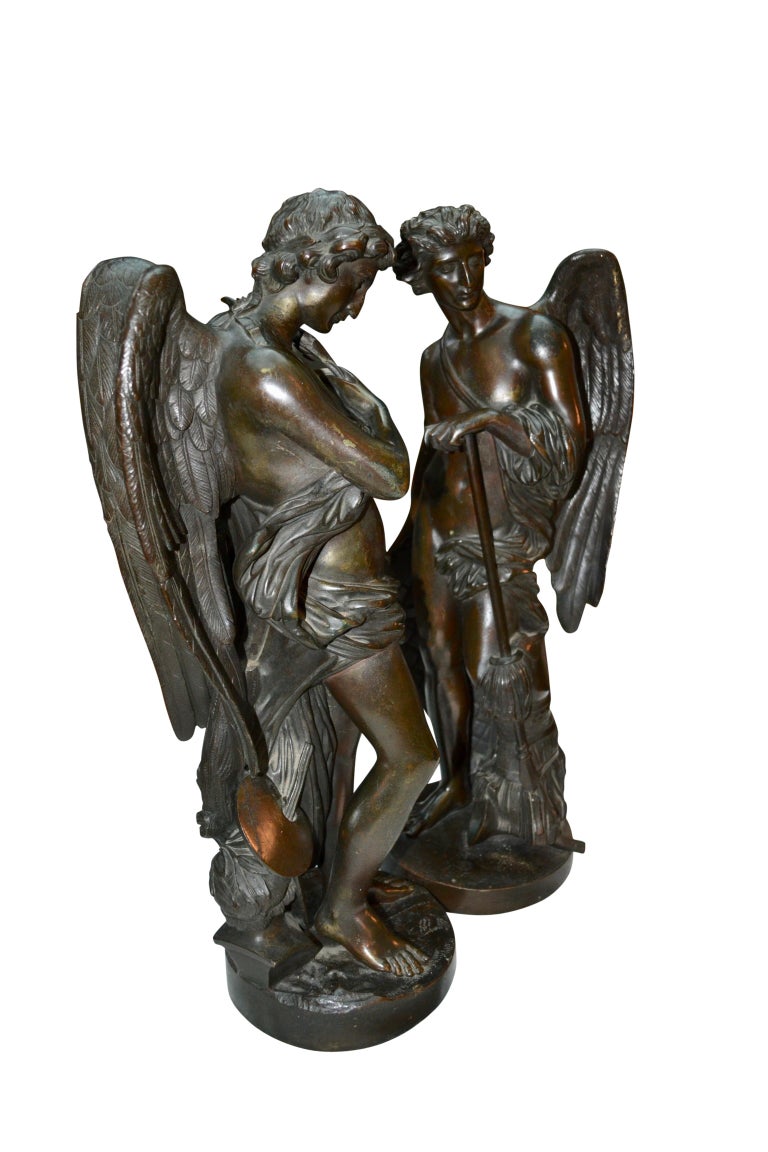 Pair of Patinated Bronze Winged Figural Male Classical Greek Statues