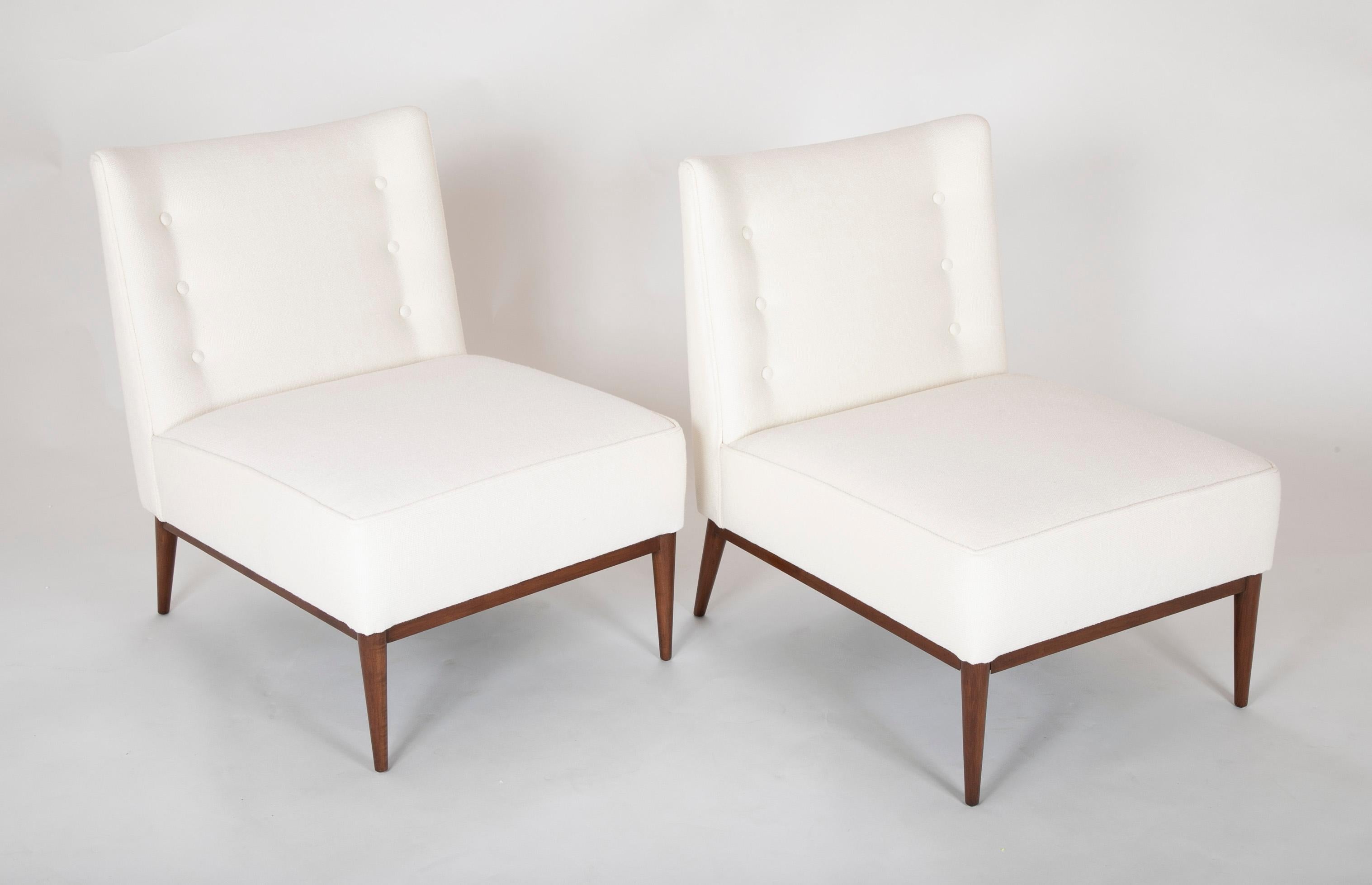 A pair of slipper chairs designed by Paul McCobb. Upholstered in Rogers & Goffigon fabric. Lounge chair, model 300 produced by Custom Craft, Inc. USA, 1952 Mahogany

literature: Directional Designs: Paul McCobb, manufacturer's catalog, pg. 82.
