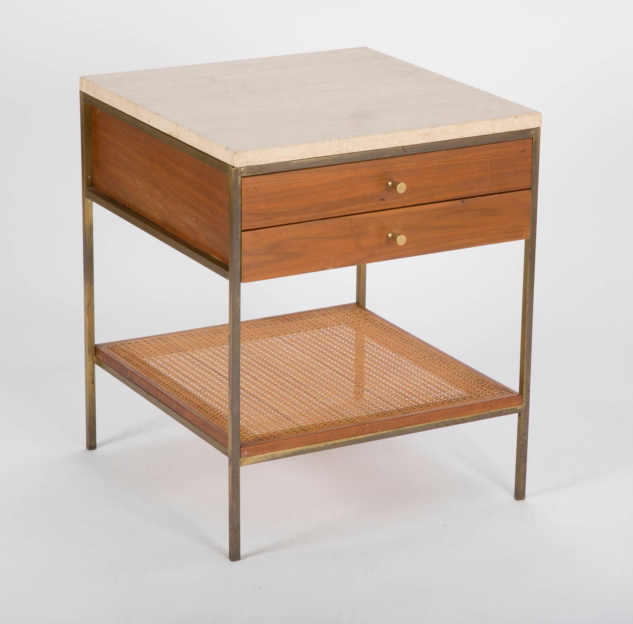 A pair of model 8714 nightstands with marble tops and caned shelfs. Designed by Paul McCobb.