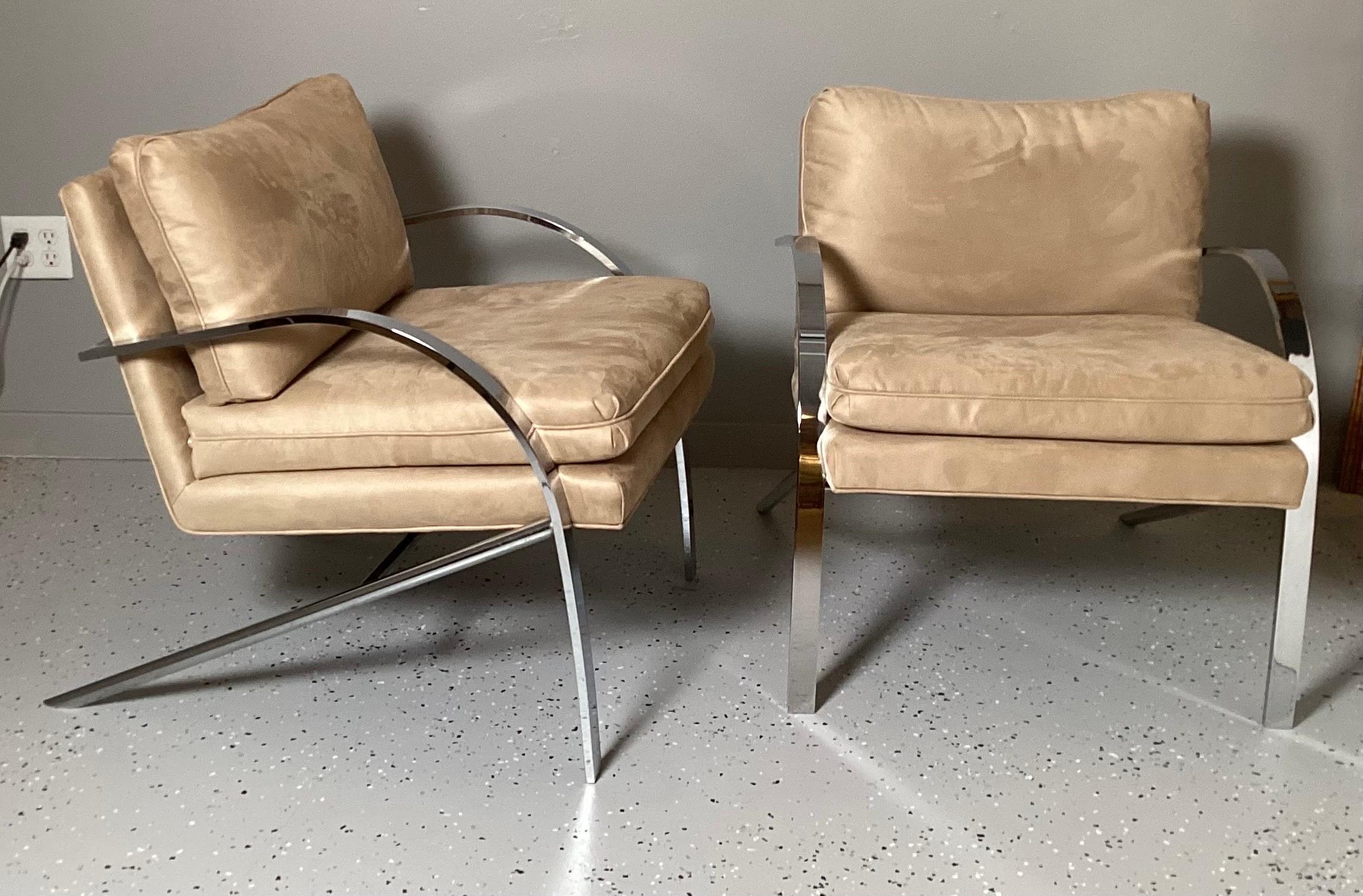 A Stunning pair of Paul Tuttle lounge chairs in tan Ultrasuede. The chrome is bright and in excellent condition the fabric is very clean.