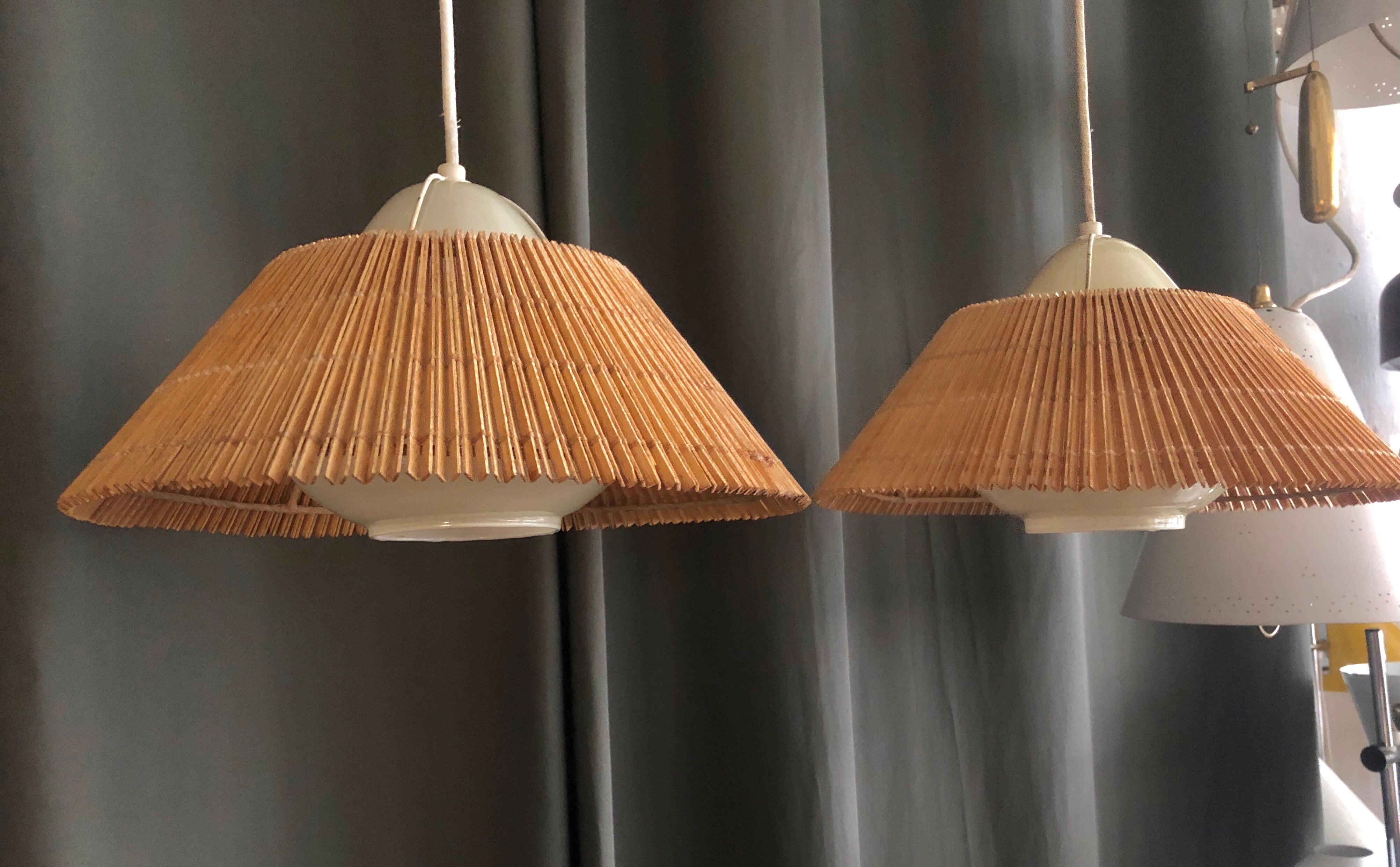 A pair of vintage pendants designed by Lisa Johansson-Pape for Orno, Finland , Circa 1950th. Opaline glass defusers with wooden stripes shades.
Existing wires, rewiring available upon request.
Can be sold separate.