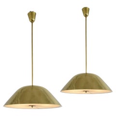 A pair of pendants by Paavo Tynell