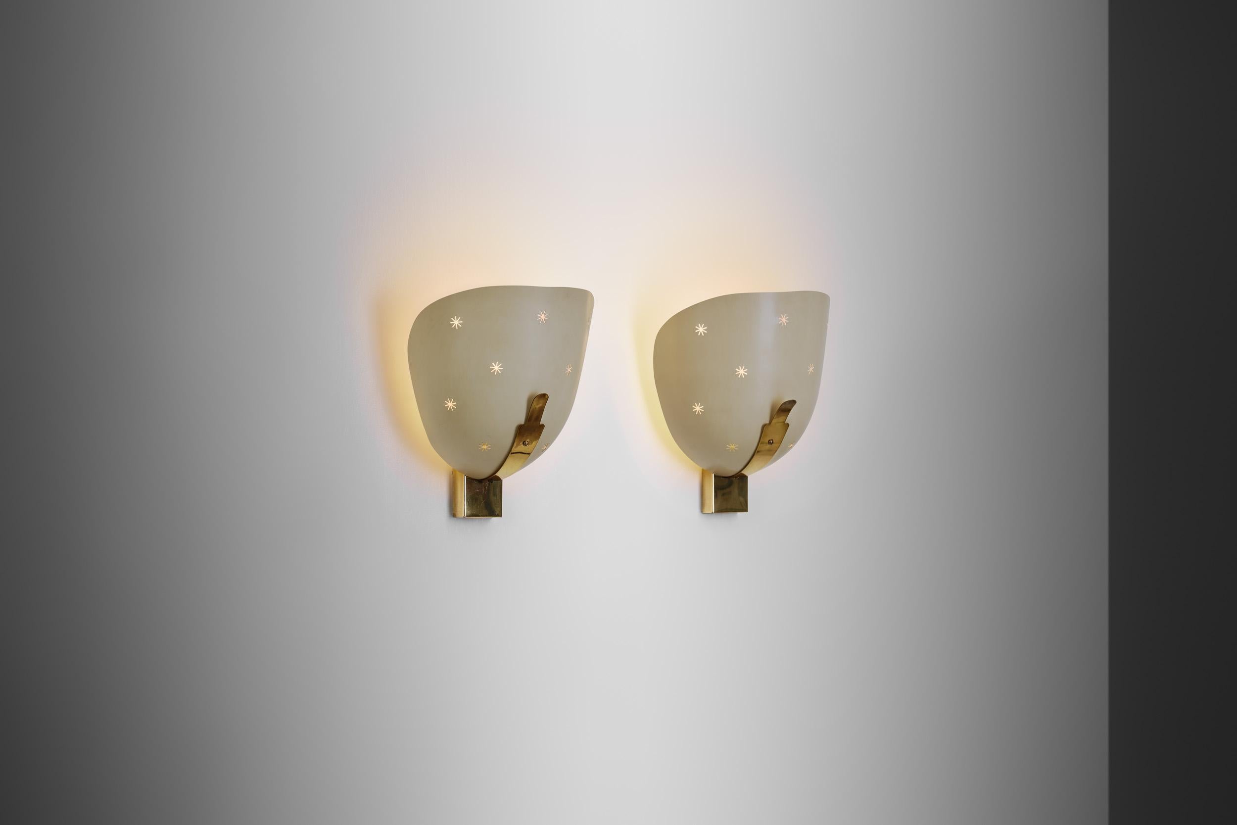 These early 1950s wall sconces show the lesser seen whimsical side of mid-century design. While having some of the main design elements European mid-century lighting design is known for, these lamps are entirely unique, with a charming look that