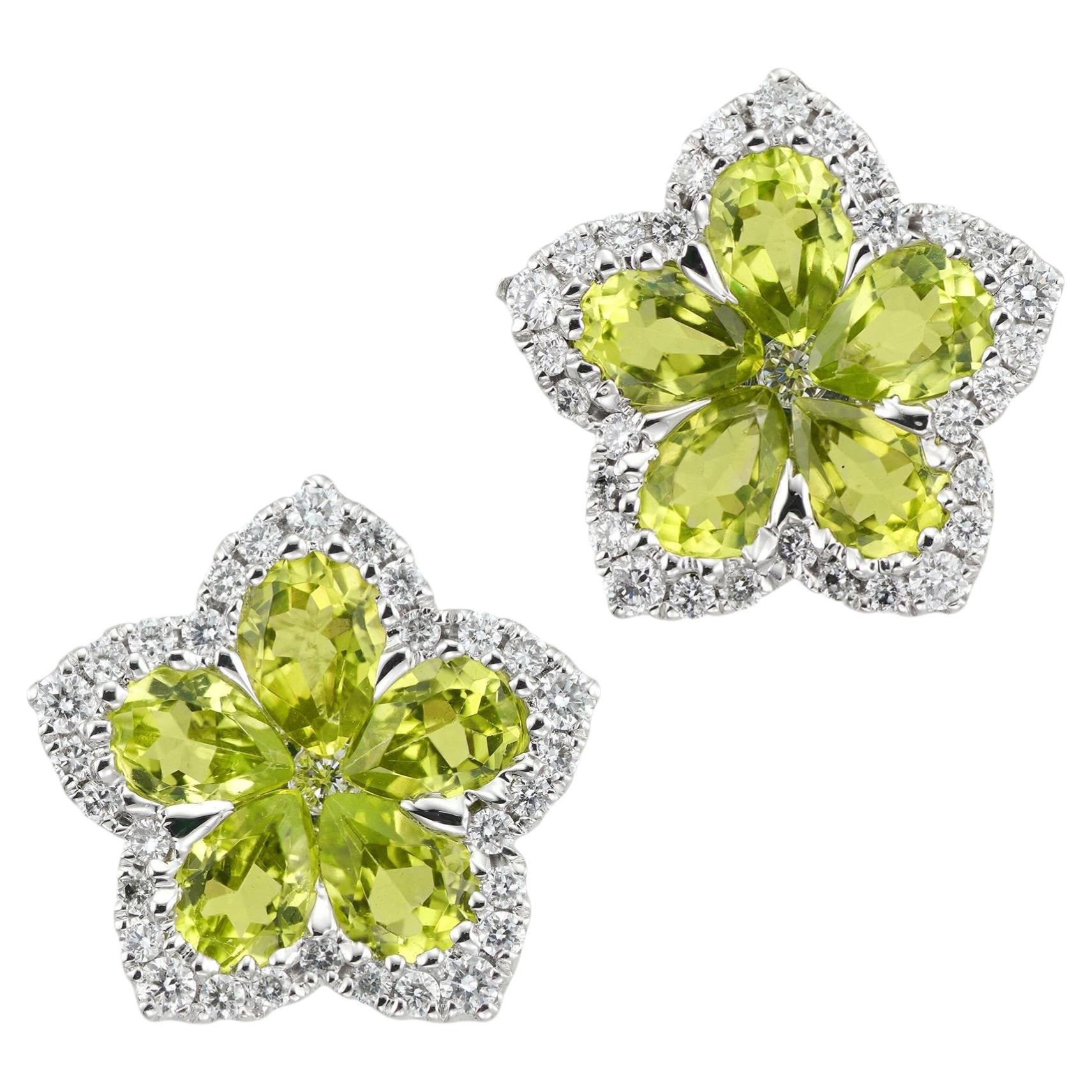 A pair of peridot and diamond flower cluster earrings For Sale