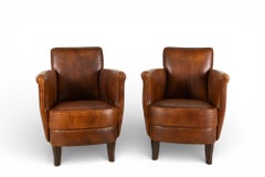 A Pair of Petite Leather Chairs