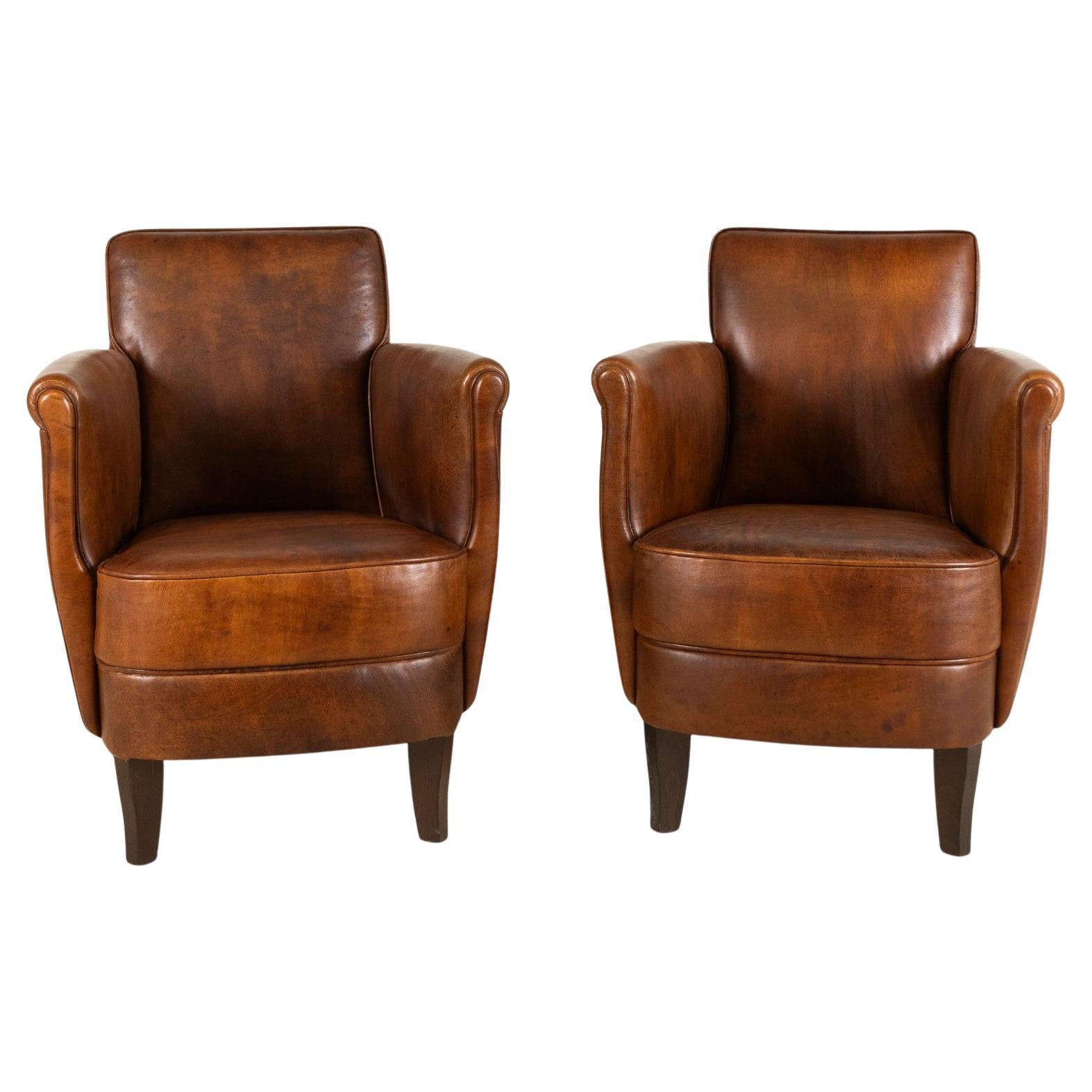 A Pair of Petite Leather Chairs
