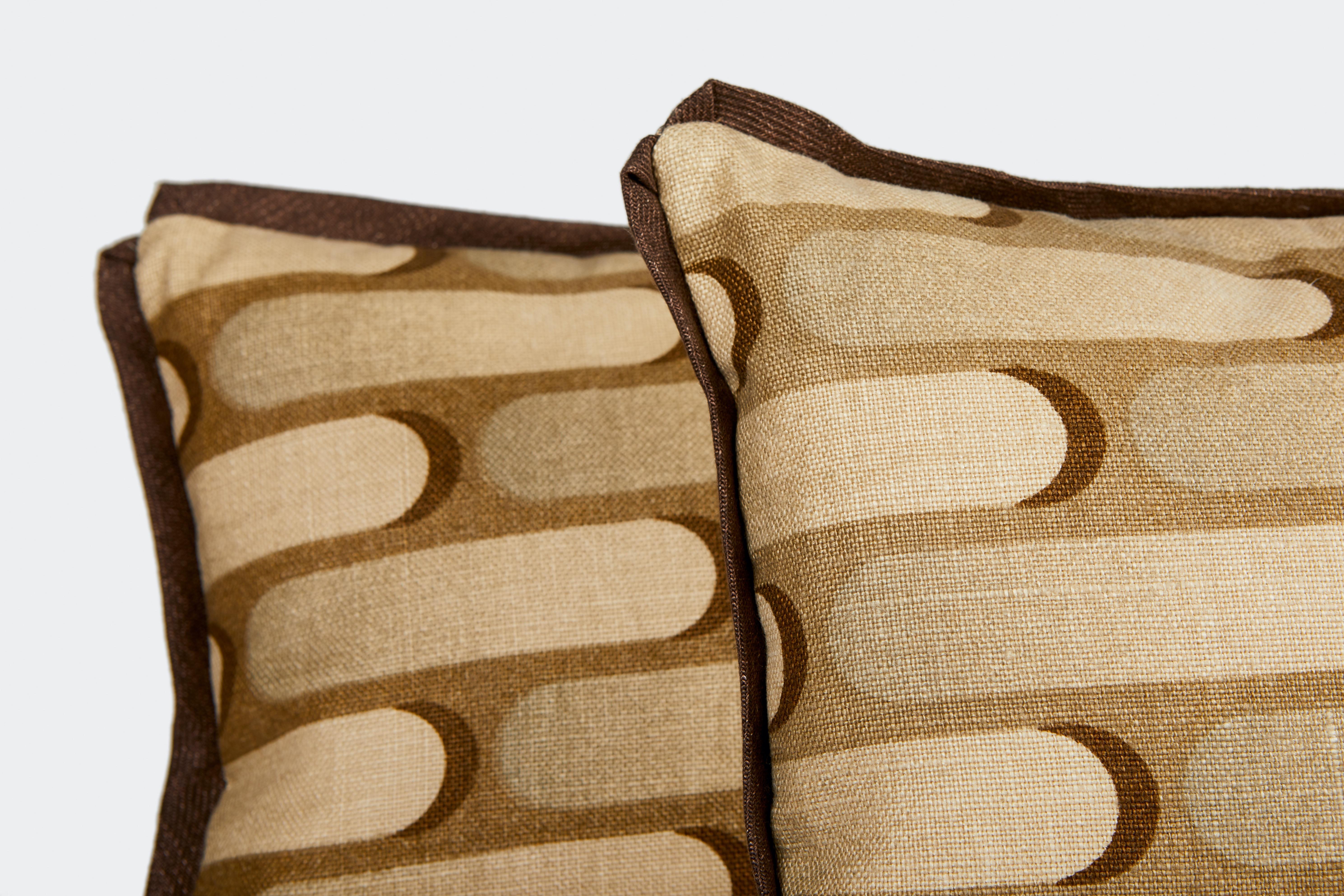 A pair of printed linen fabric lumbar cushions with bias linen trim, the fabric is a contemporary design by Pierre Cardin, circa 1980. Newly made, featuring this unique vintage fabric. 50 down/50 feather insert.

 