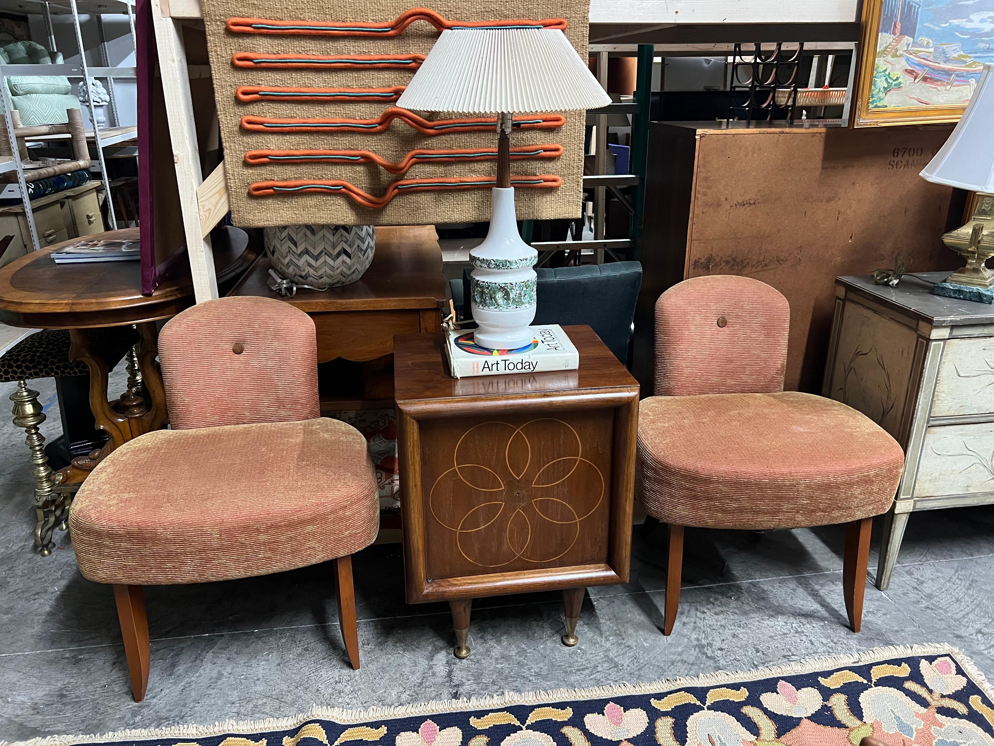 A lovely pair of art deco cocktail chairs in a salmon and gold upholstery, which seems to be original and in immaculate condition especially for age.   They feature a large seat with a small back and the proportions make for a stunning look.  The