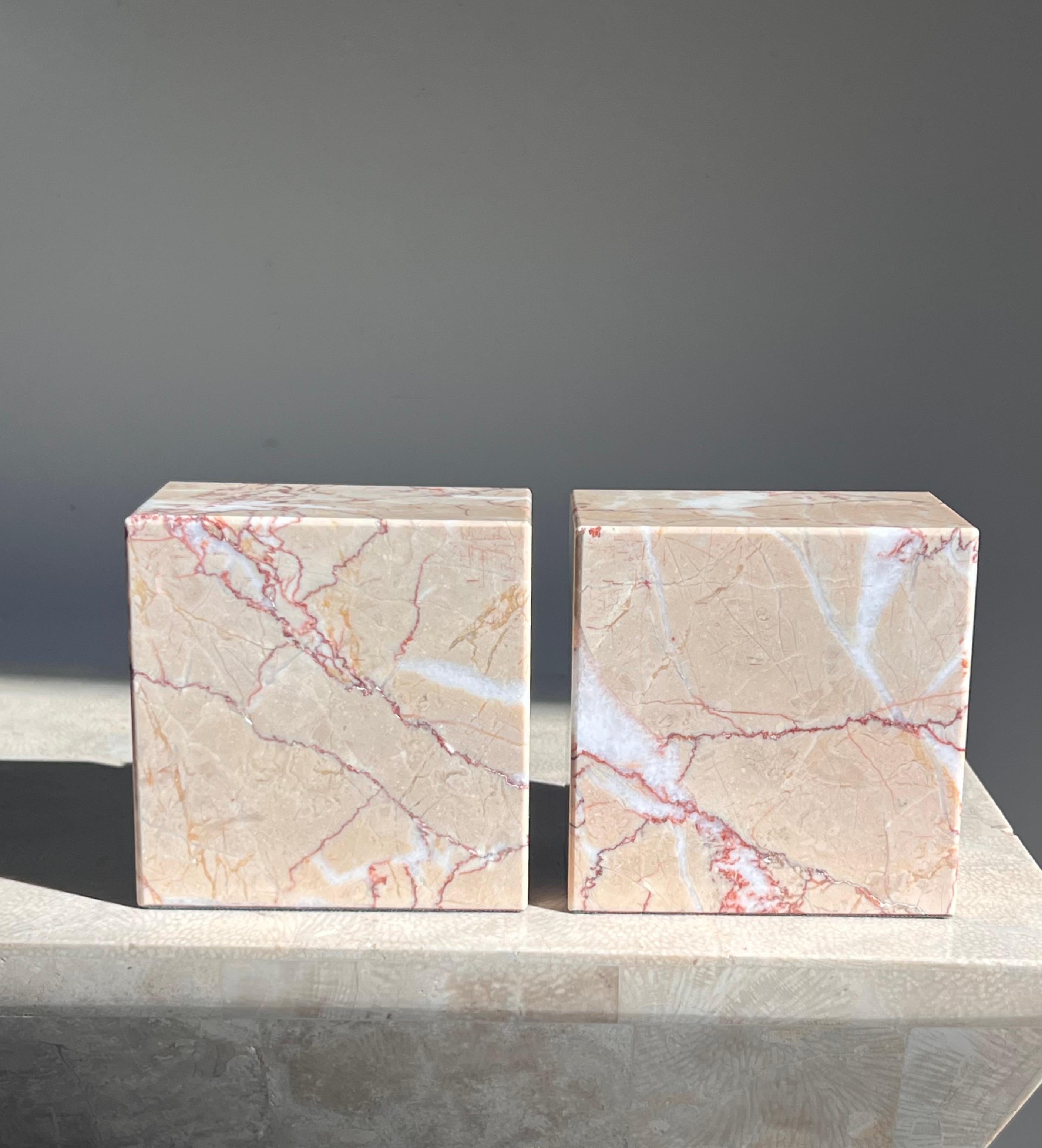 American A pair of pink marble bookends by Vermont Marble Co, mid 20th century  For Sale