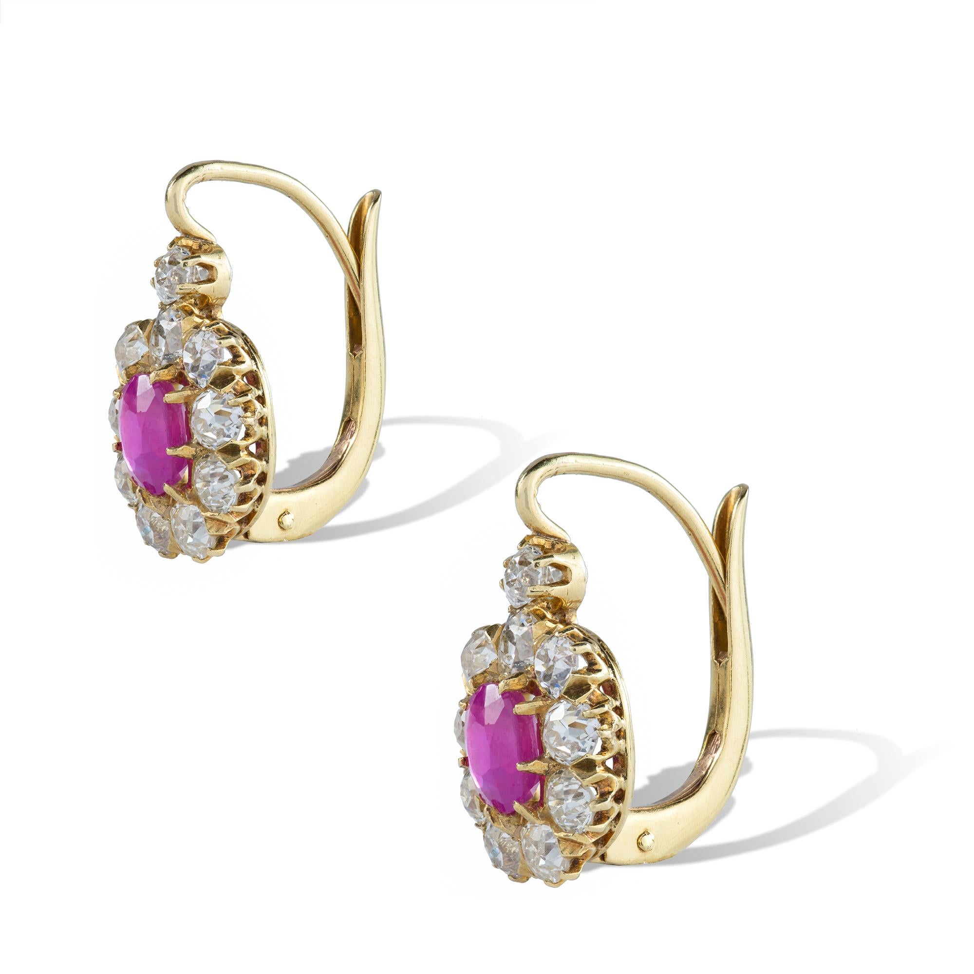 A pair of late Victorian pink-sapphire and diamond cluster earrings, the cushion-cut faceted sapphires, weighing a total of 1.28 carats, accompanied by GCS Report: 5777-8958 stating to be of Burmese origin with no indication of heat, claw-set to an
