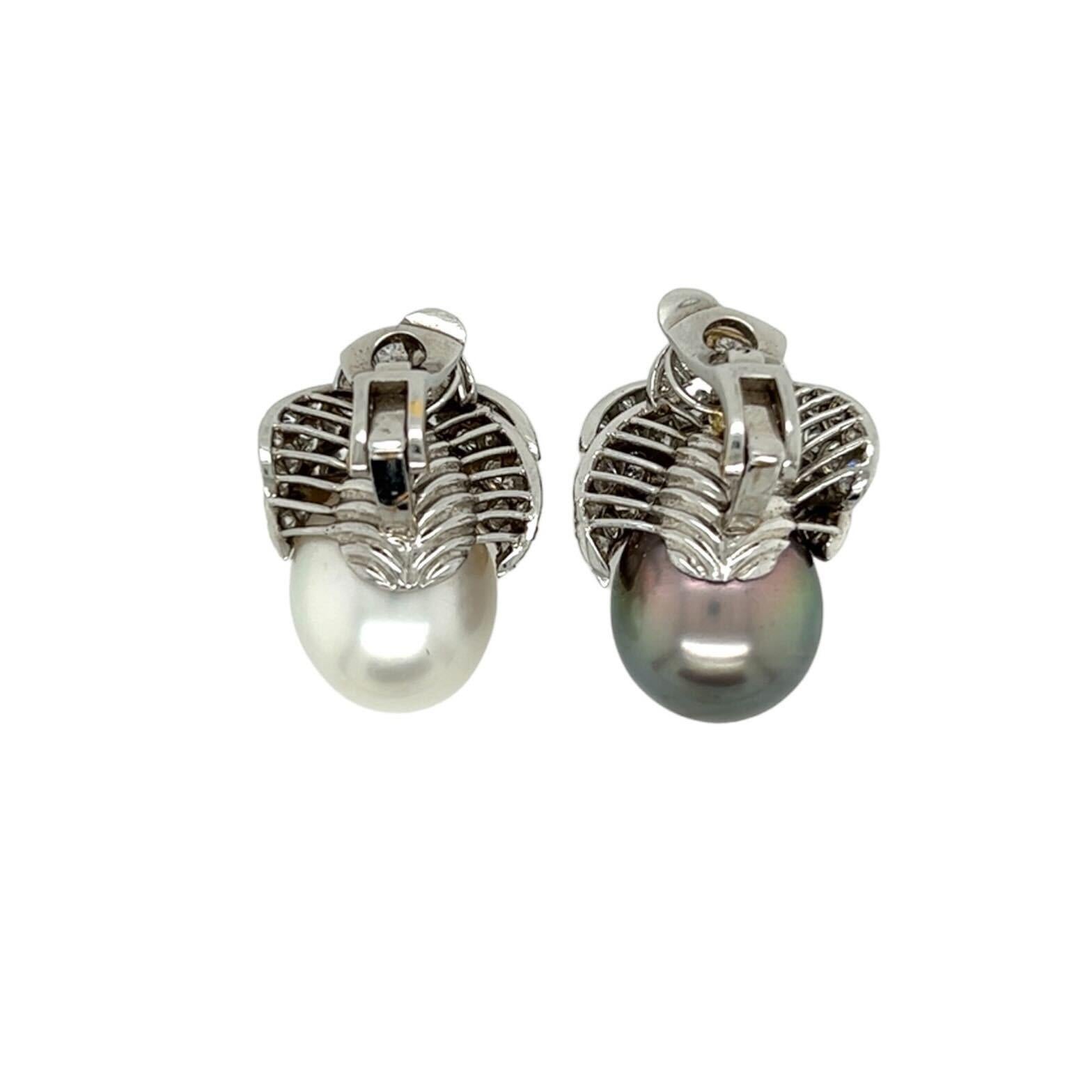 A pair of platinum, 18 karat white gold, pearl and diamond earclips.  The first earclip designed as a drop shaped Tahitian pearl topped by an overlapping surmount of thirty seven (37) platinum set brilliant cut diamonds, with an 18 karat white gold