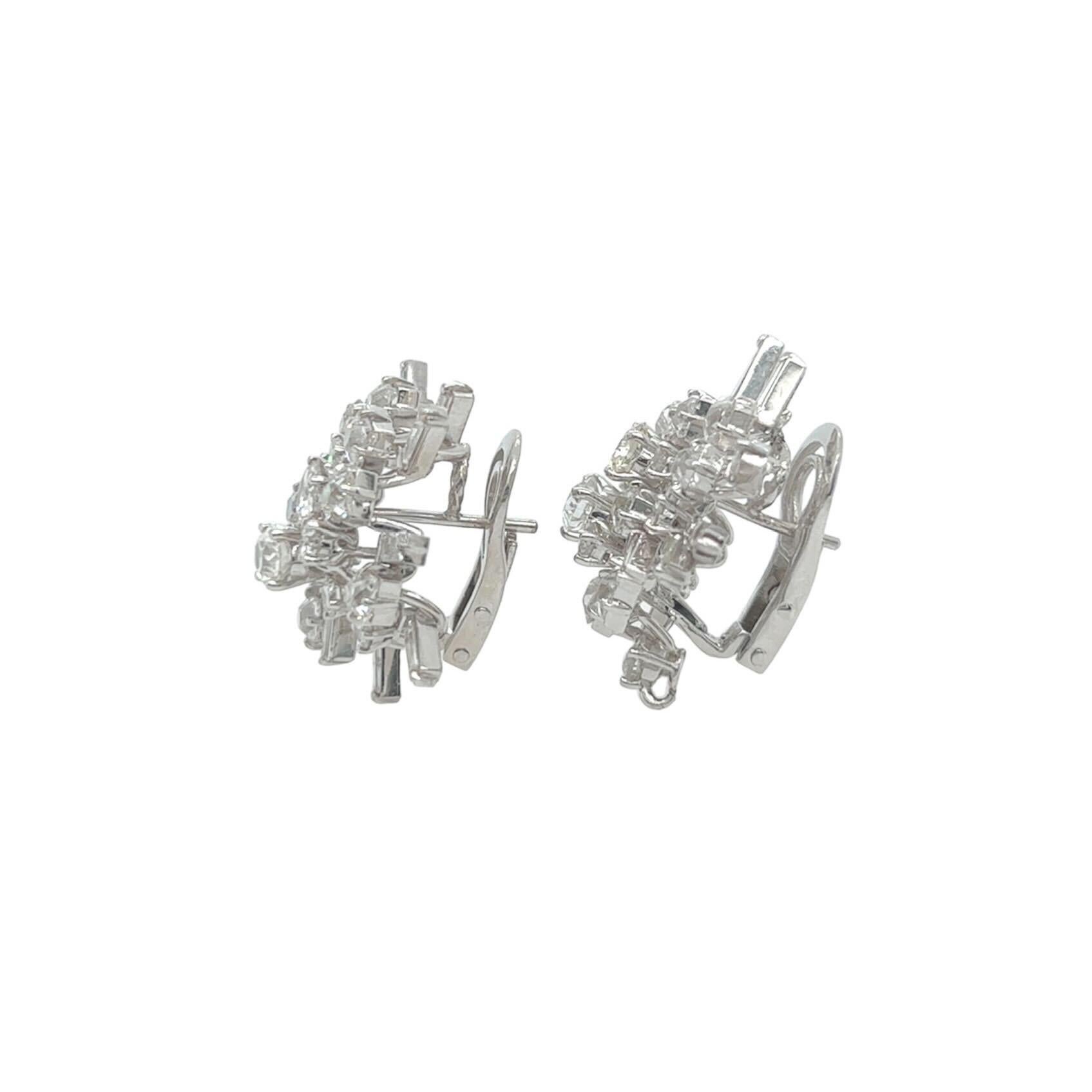 Round Cut A Pair of Platinum and Diamond Earrings For Sale