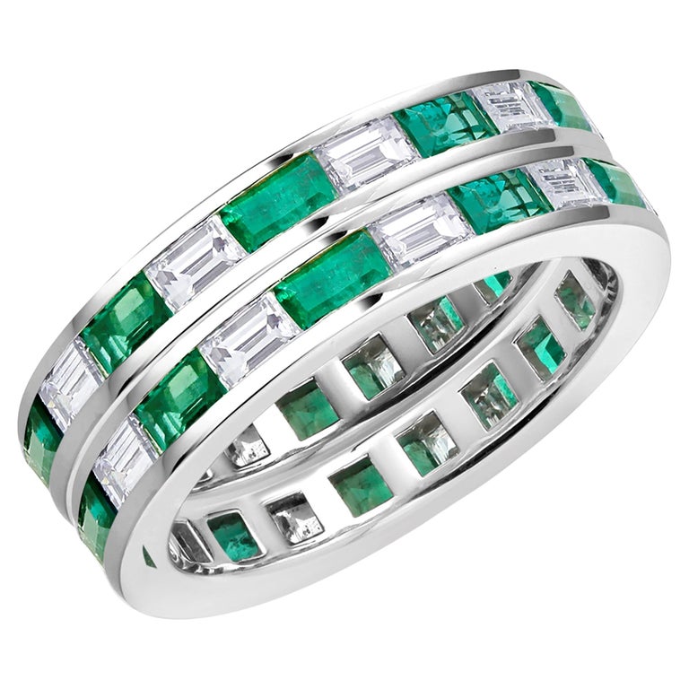 Pair of Platinum Baguette Shaped Emerald and Diamond Eternity Bands For Sale