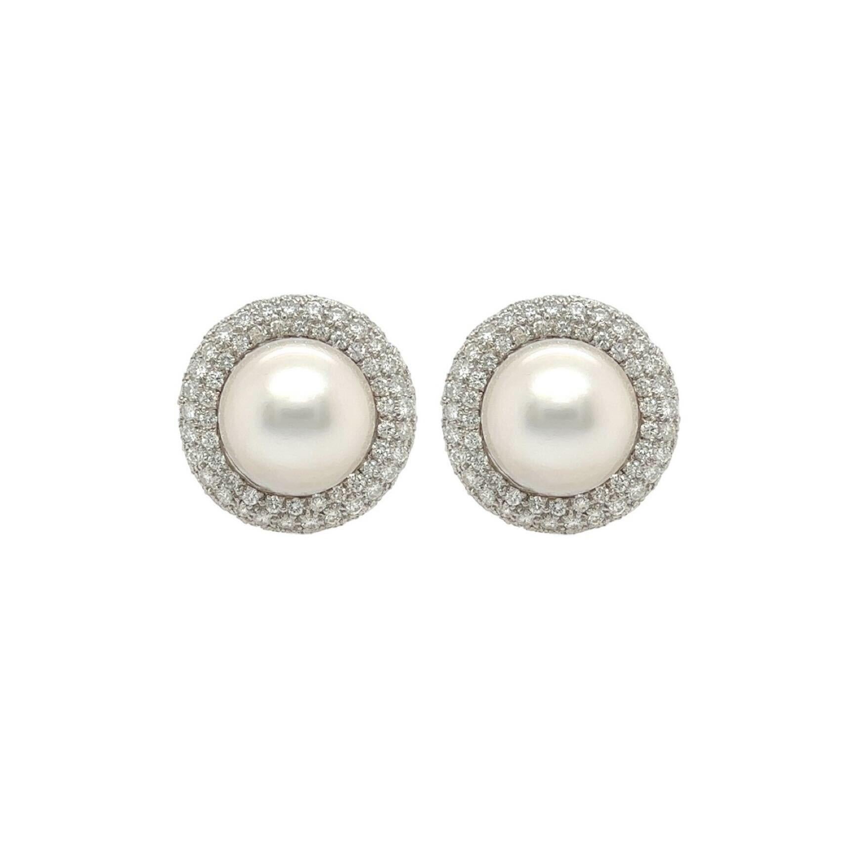 A Pair of Platinum, Pearl and Diamond Earrings