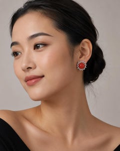 Une paire de boucles d'oreilles en platine, corail rouge et diamants