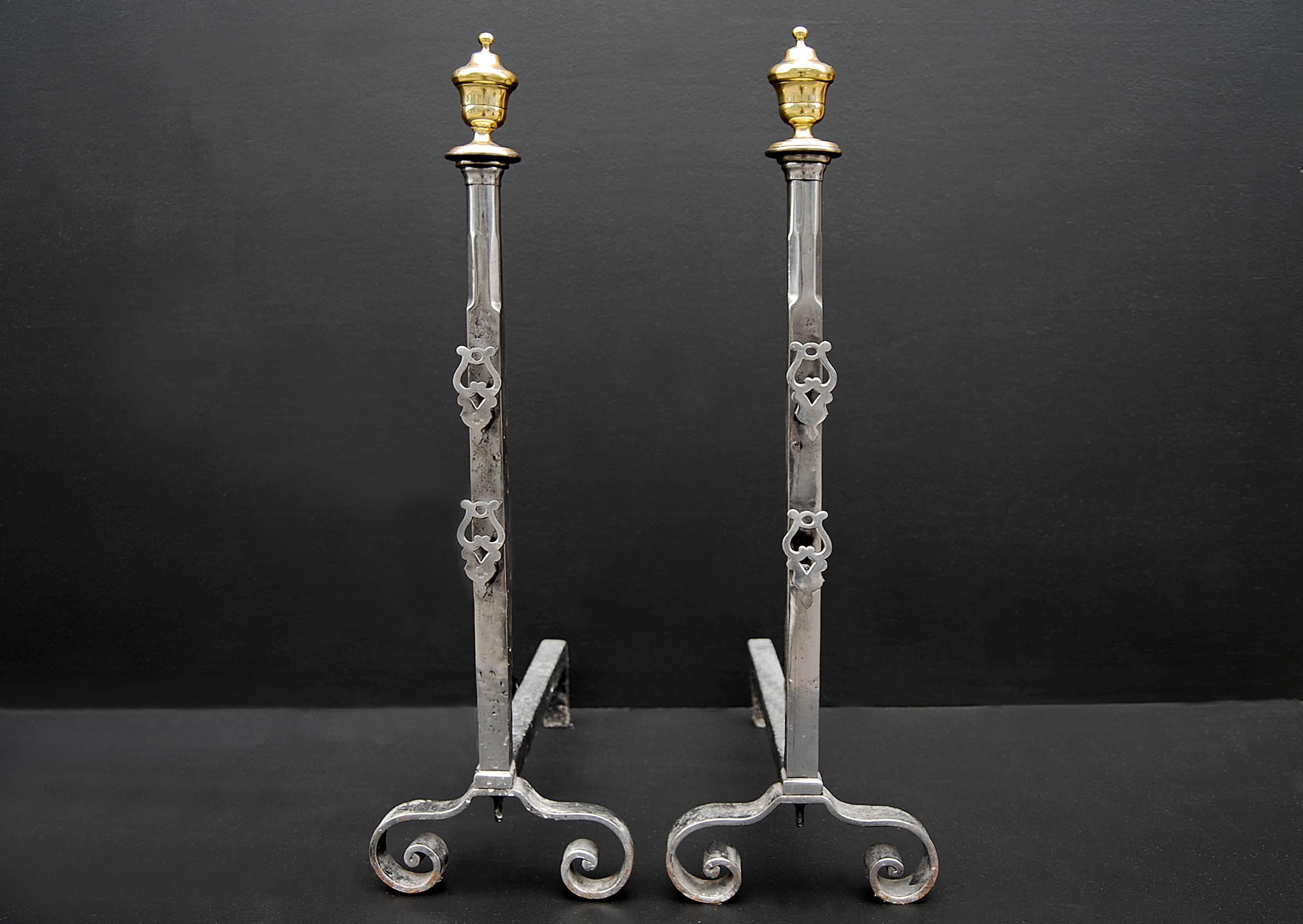 English Pair of Polished Steel Firedogs with Brass Urn Finials For Sale