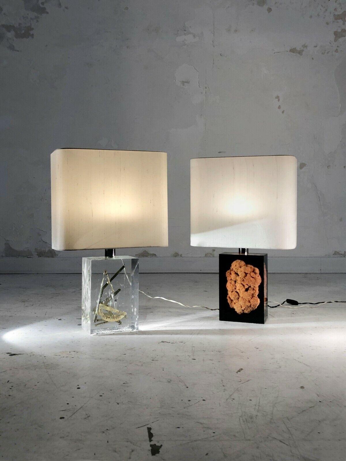 A spectacular and poetic pair of rectangular lucite table lamps : 2 massive inclusions of coral and golden objects topped with original lampshades, by Pierre Giraudon France 1970.

SOLD WITH THEIR ORIGINAL LAMPSHADE

DIMENSIONS:
Dimensions of each