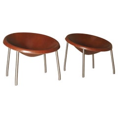 A pair of 'Poppea' easy chairs from Arte & Cuoio by Enrico Tonucci