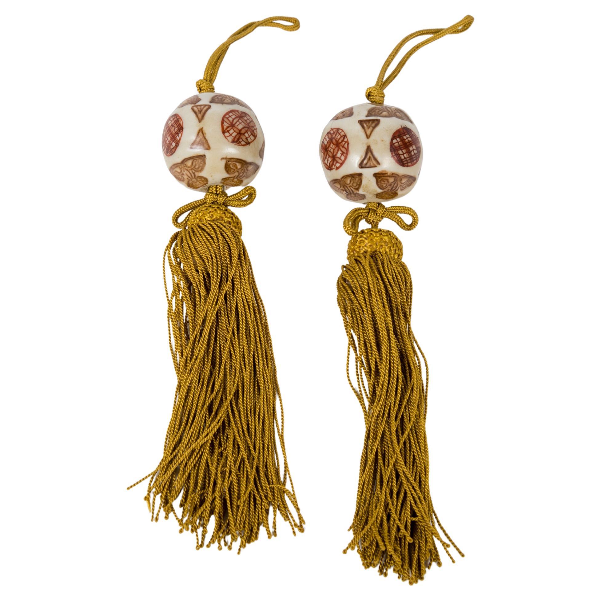 A Pair of porcelain fuchin or kakaemono weights