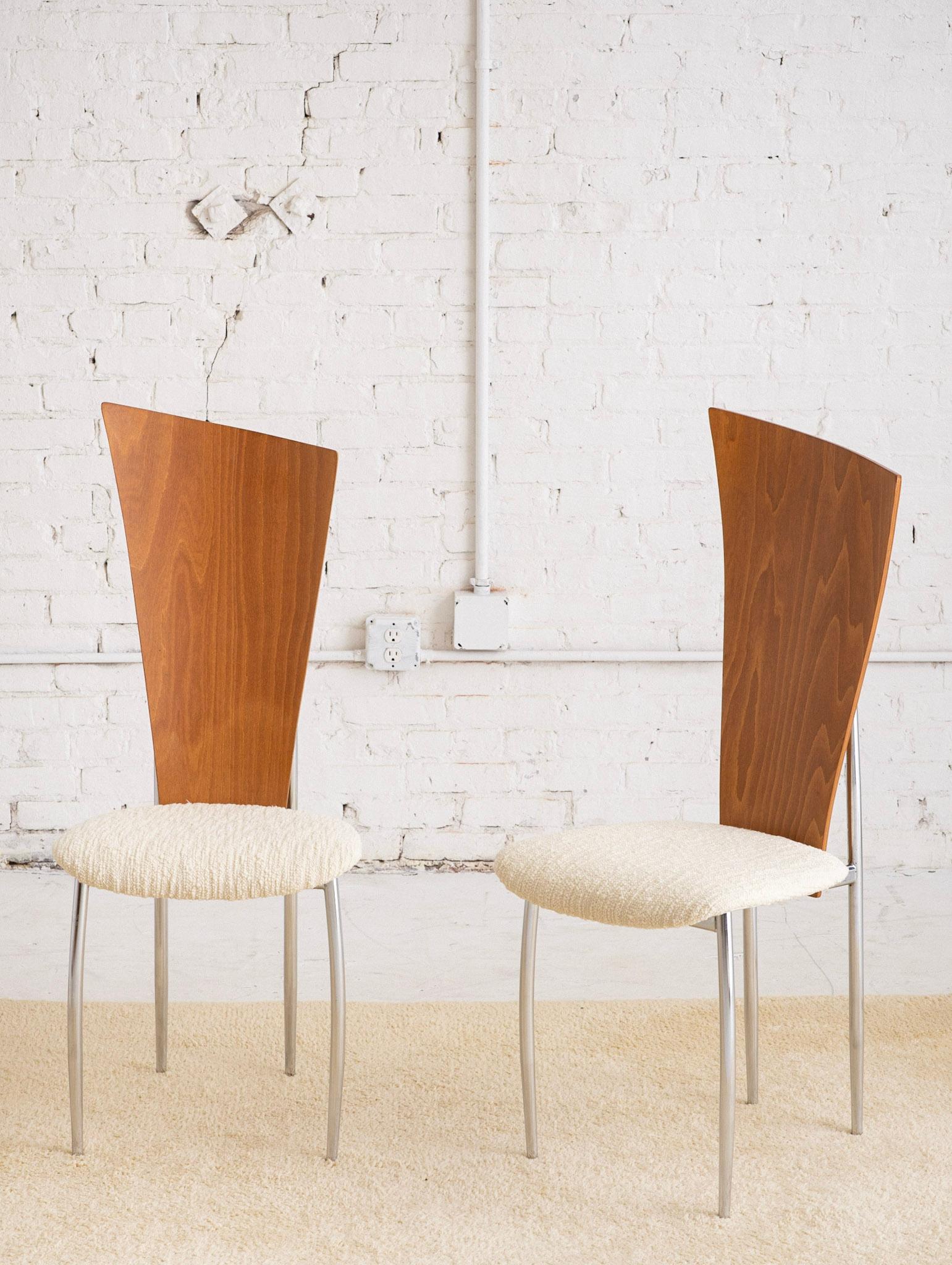 A pair of post modern chrome and molded plywood dining chairs. New textured wool upholstery. Retains 