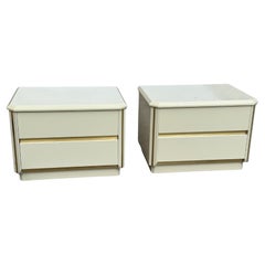 A pair of Postmodern artdeco Lacquered Cream Nightstands, Circa 1980s
