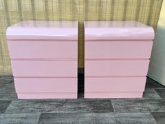 A pair of Postmodern Pink Formica Waterfall Nightstands. Circa 1980s