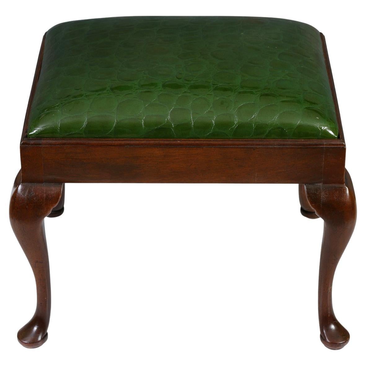 Old meets new in this great looking pair of Queen Anne style benches. Each has a has rectangular top, supported by graceful cabriole legs.  They have been reupholstered in a  vibrant faux crocodile green patent leather, giving them a whole new look!