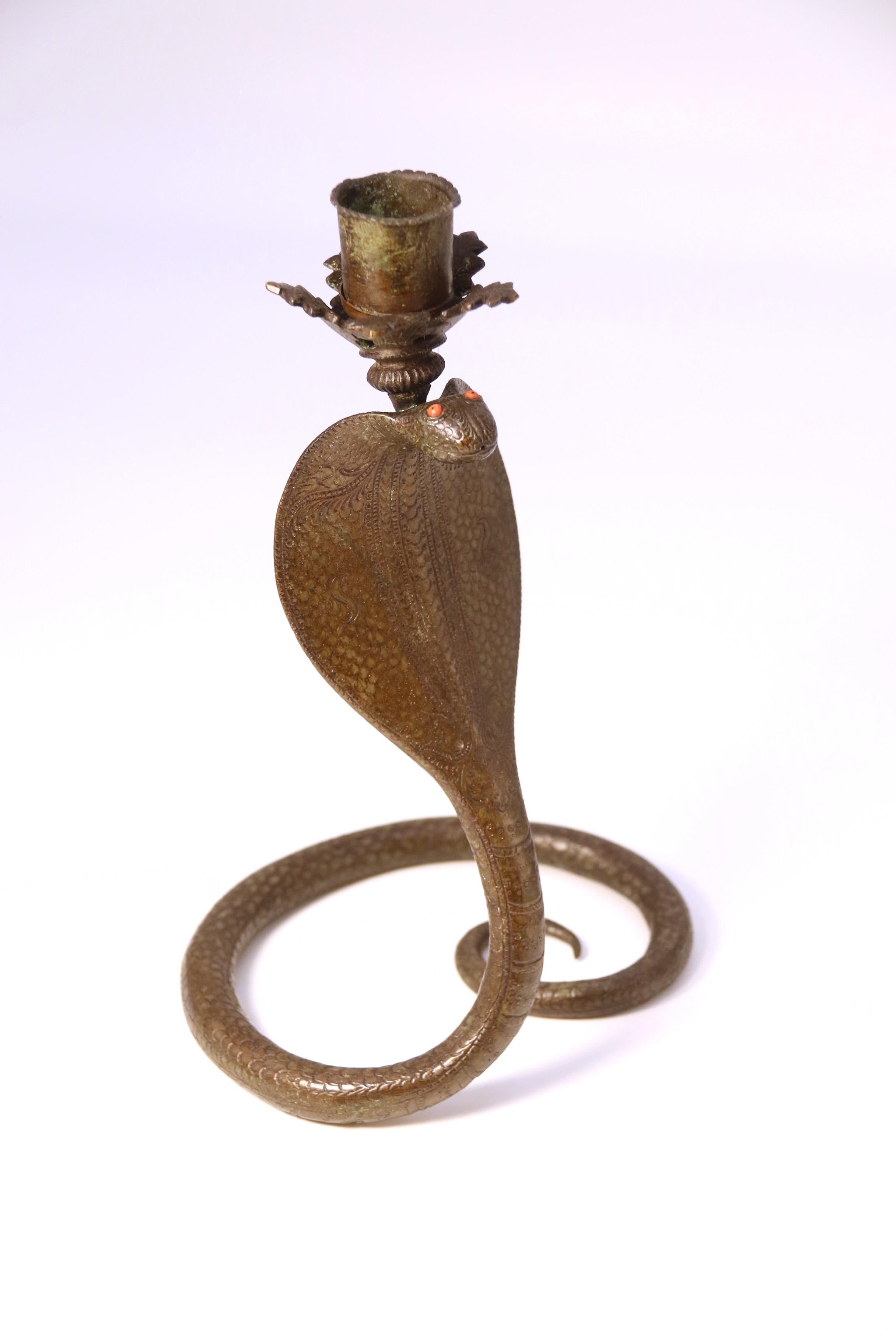 A pair of Raj period Indian bronze candlesticks in the form of striking cobras 3