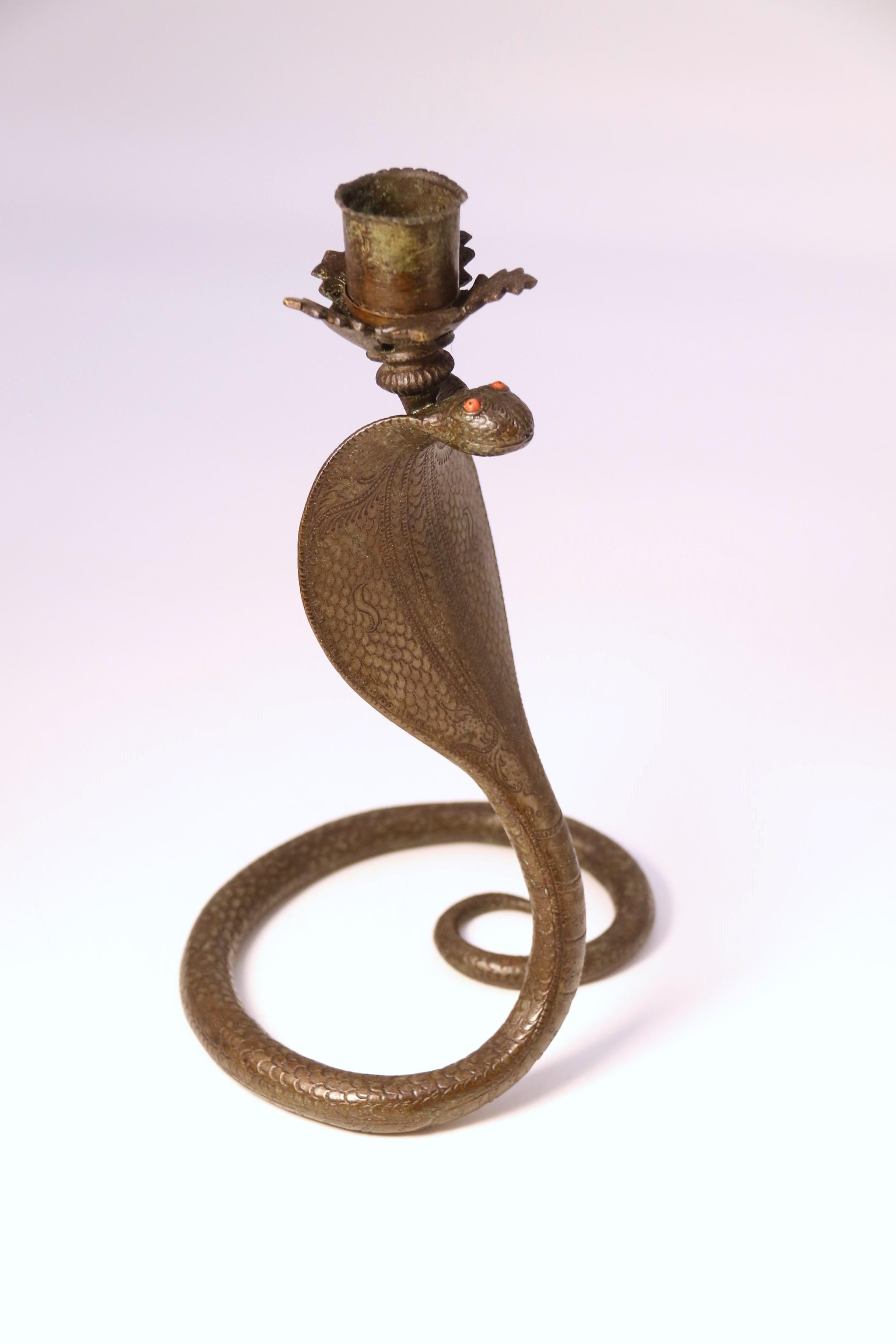 A pair of Raj period Indian bronze candlesticks in the form of striking cobras 4