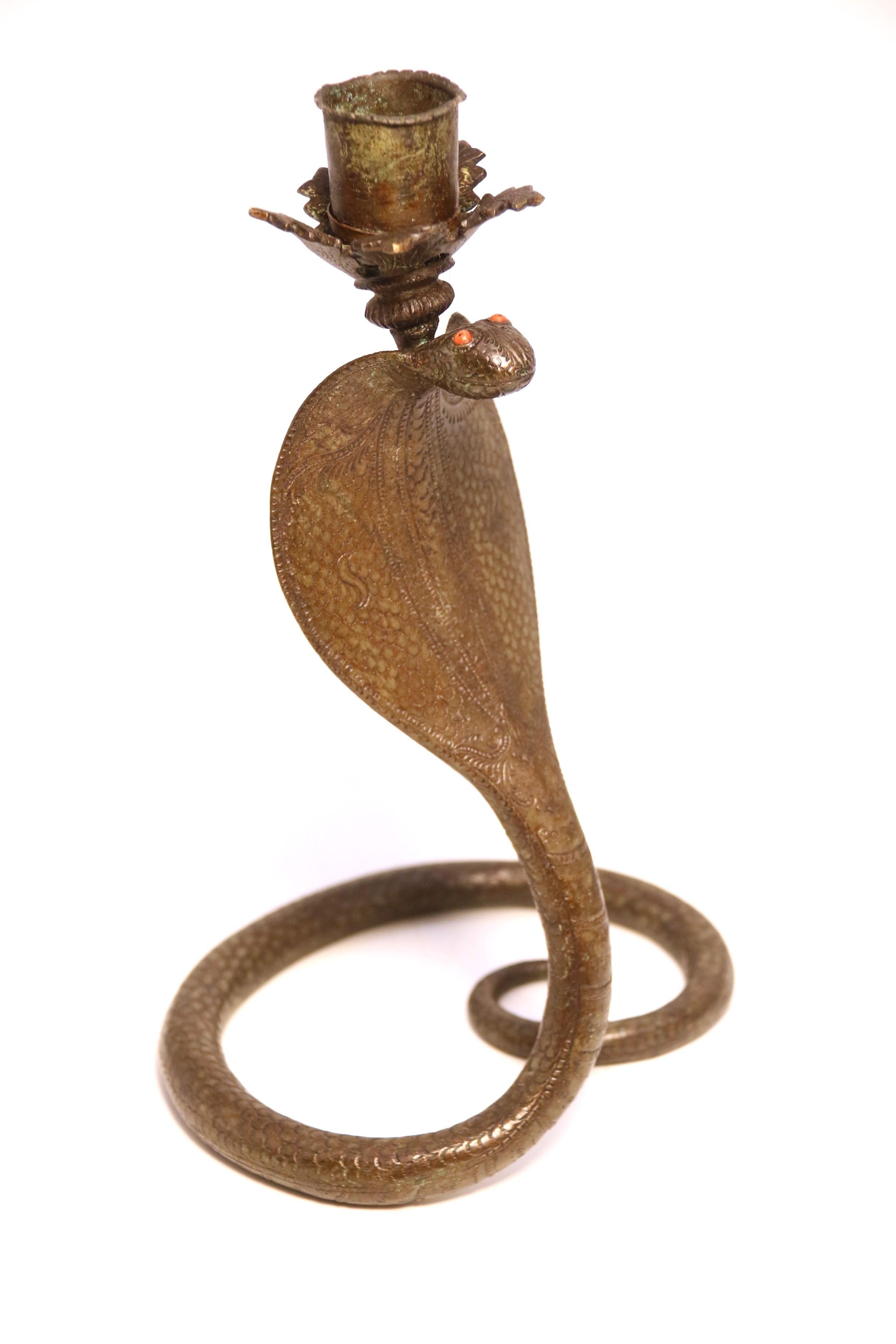A pair of Raj period Indian bronze candlesticks in the form of striking cobras 5