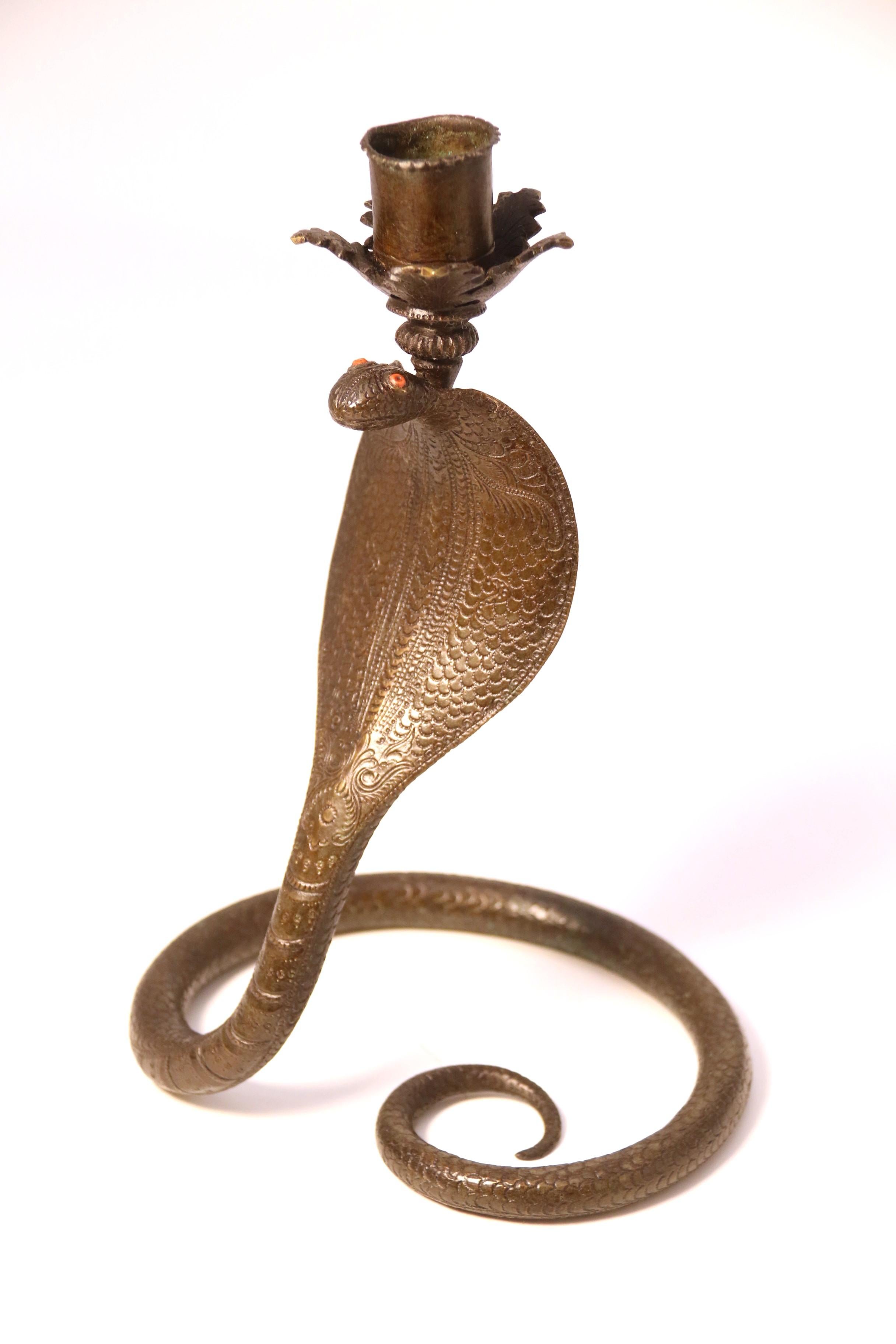 A pair of Raj period Indian bronze candlesticks in the form of striking cobras 6