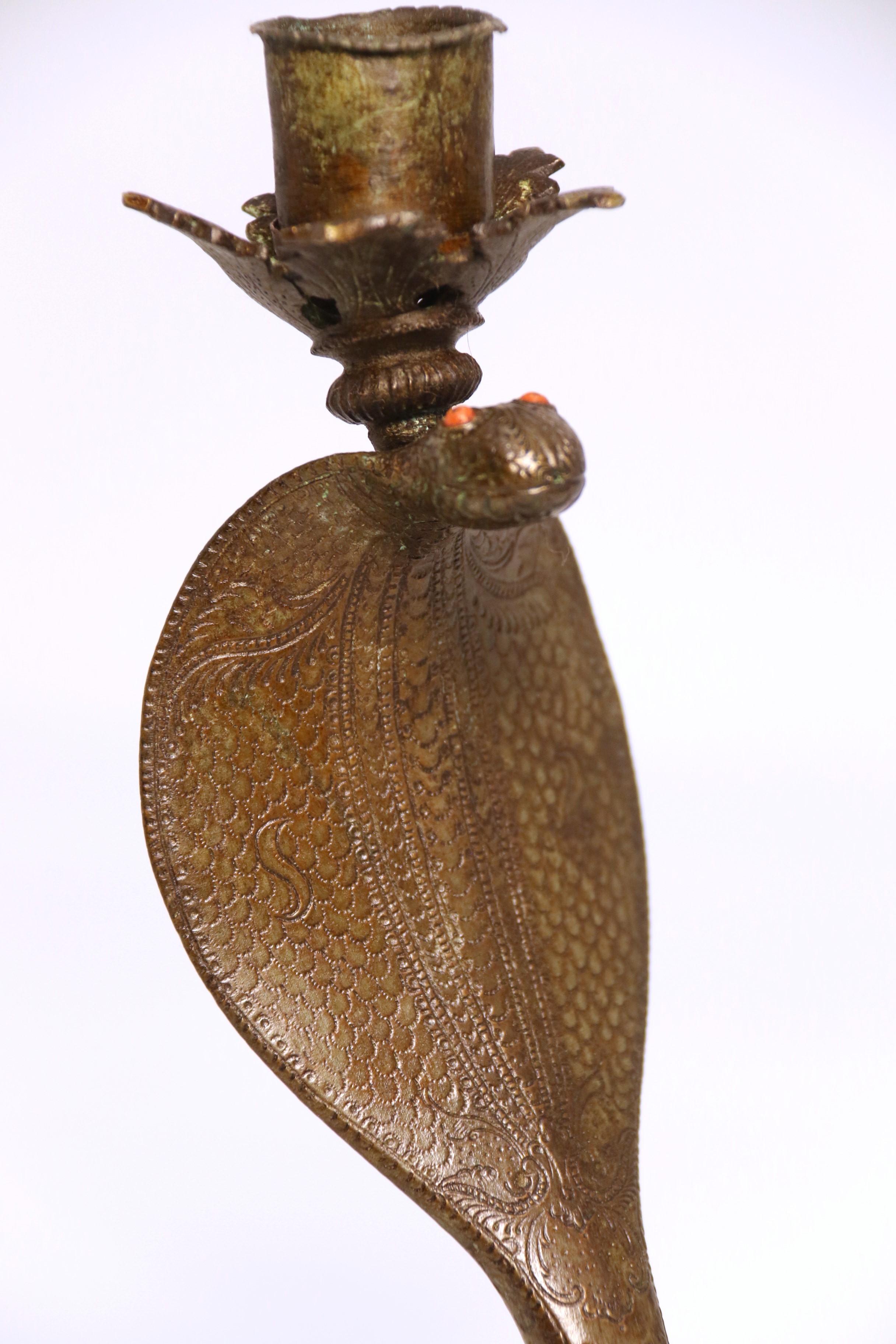 A pair of Raj period Indian bronze candlesticks in the form of striking cobras 9